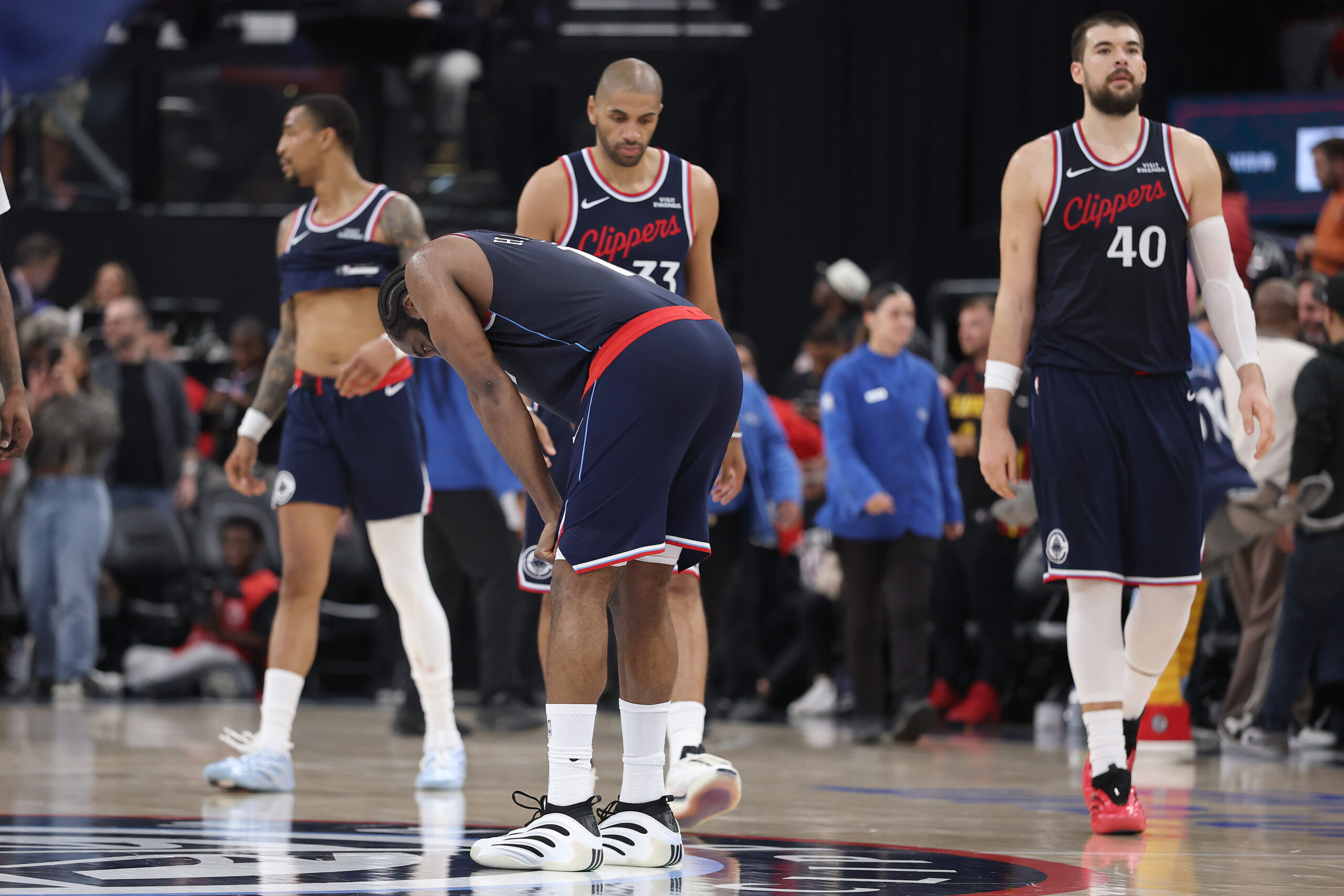 Clippers guard James Harden, front, center Ivica Zubac (40), forward...
