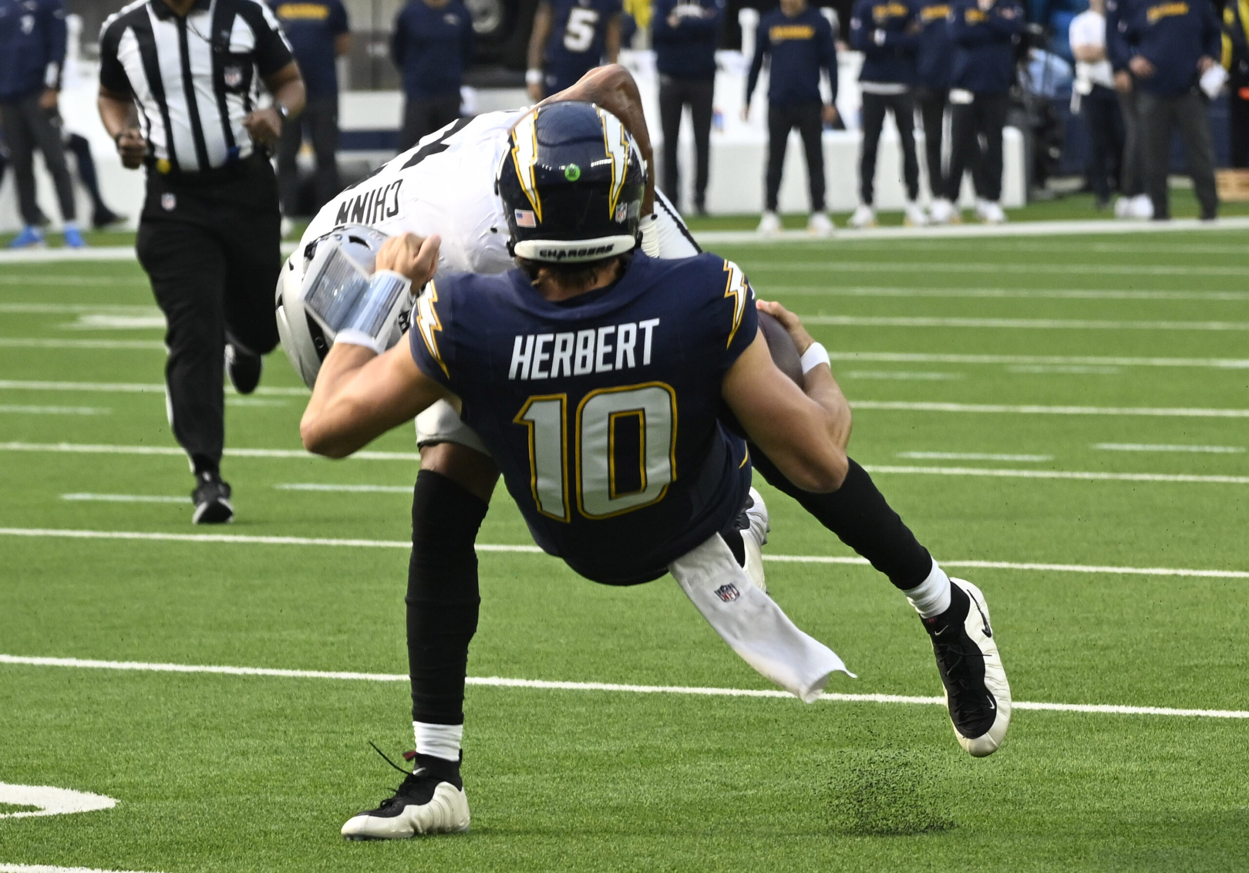 Safety Jeremy Chinn #11 of the Las Vegas Raiders tackles...
