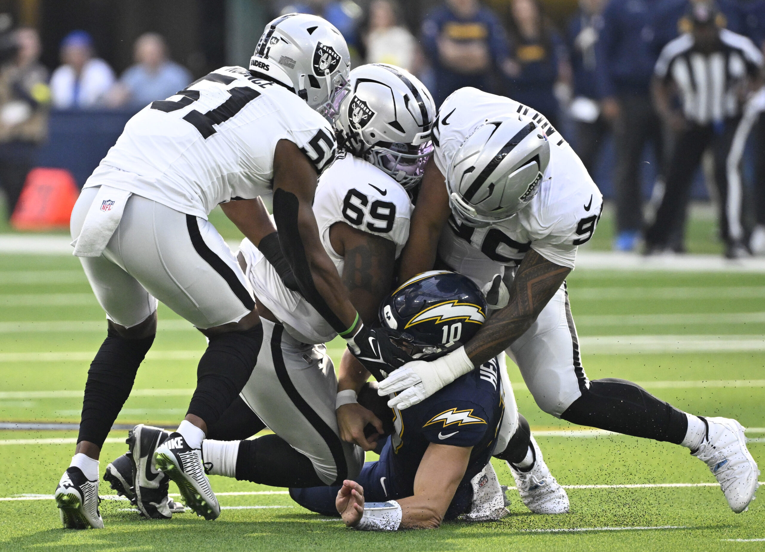 Quarterback Justin Herbert #10 of the Los Angeles Chargers is...
