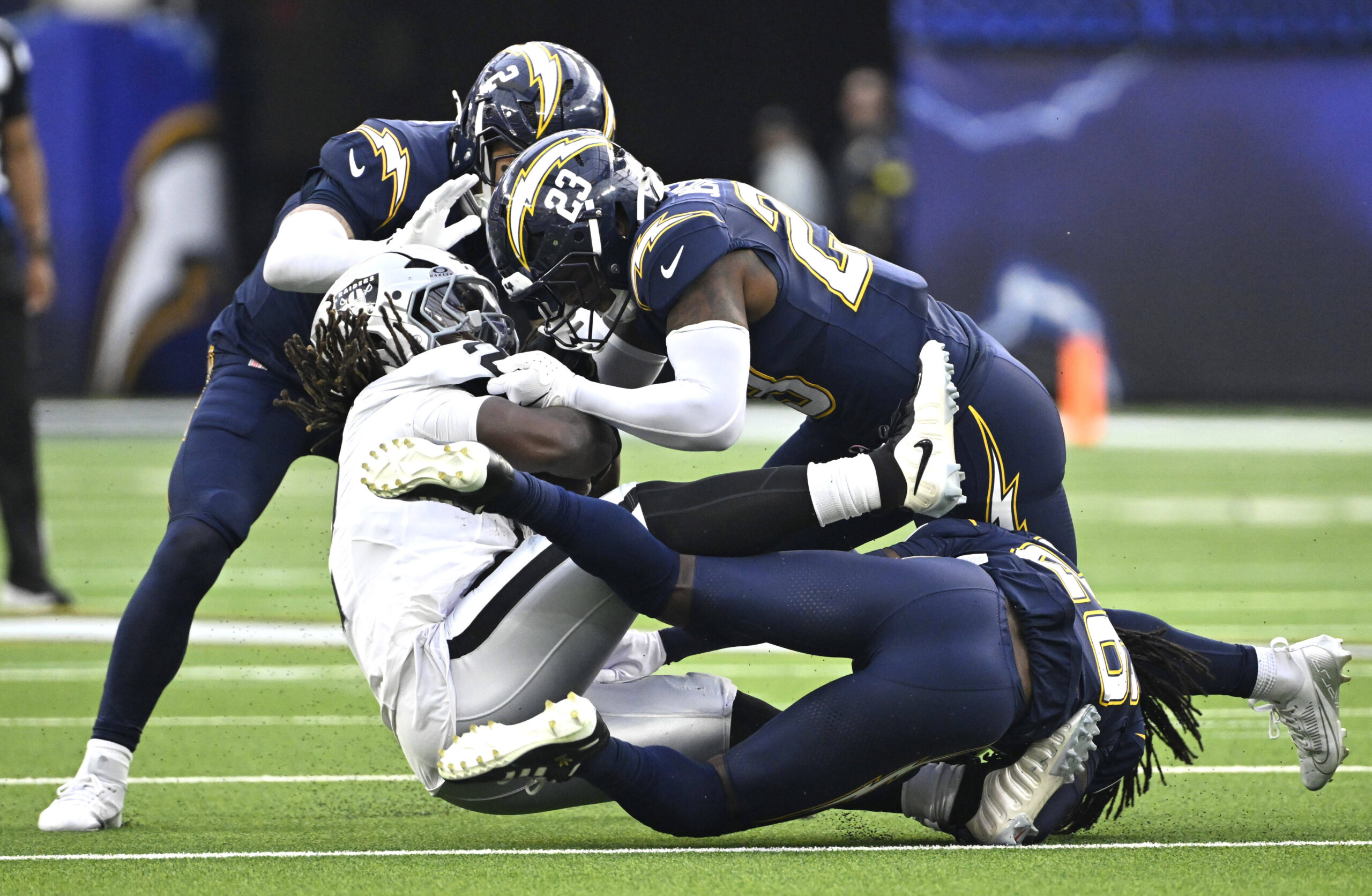 Safety Tony Jefferson #23 of the Los Angeles Chargers tackles...