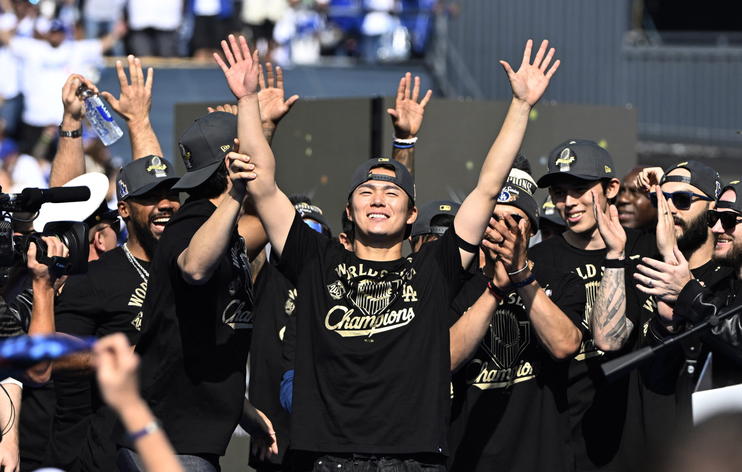 Yoshinobu Yamamoto of the Los Angeles Dodgers reacts to the...