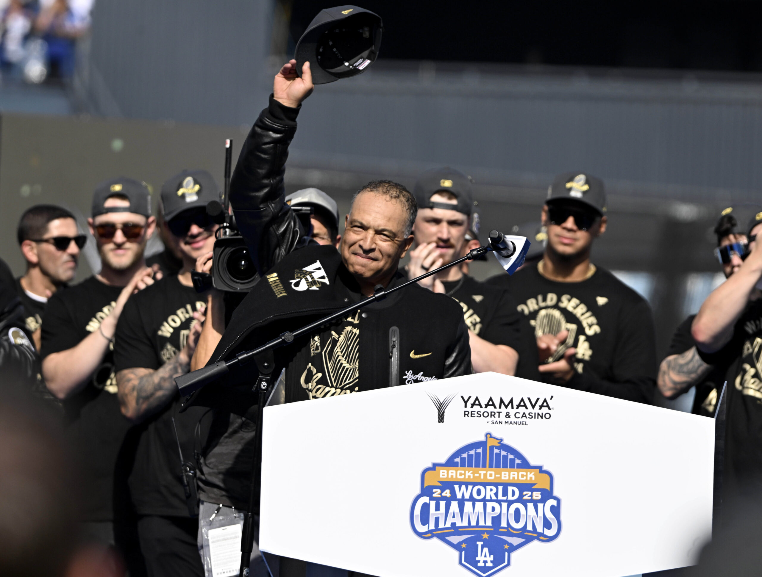 Manager Dave Roberts waves to the crowd during a celebration...