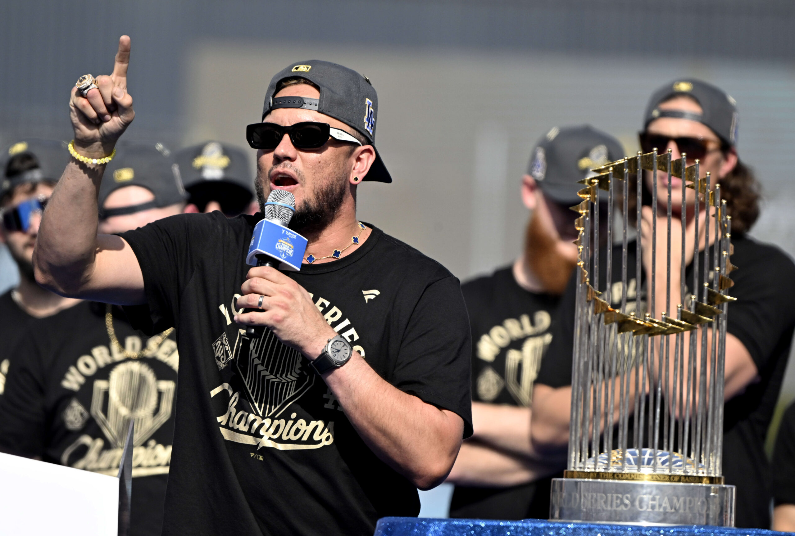 Dodgers infielder Miguel Rojas speaks to the crowd during the...