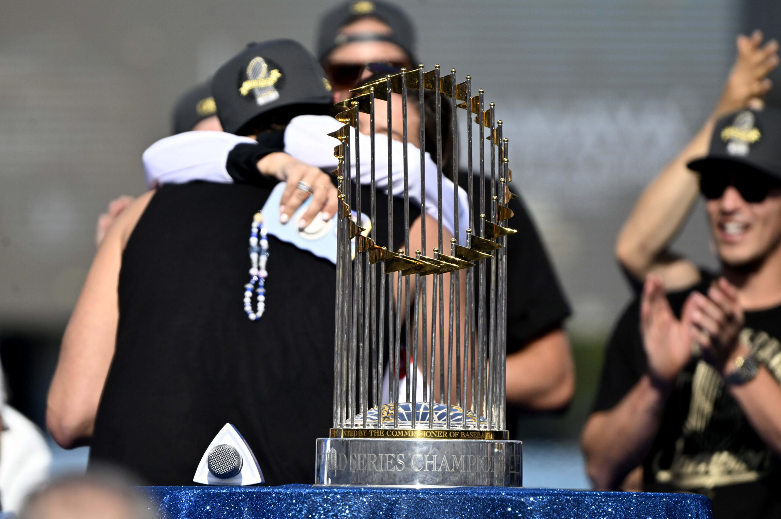 Clayton Kershaw of the Los Angeles Dodgers hugs his wife...