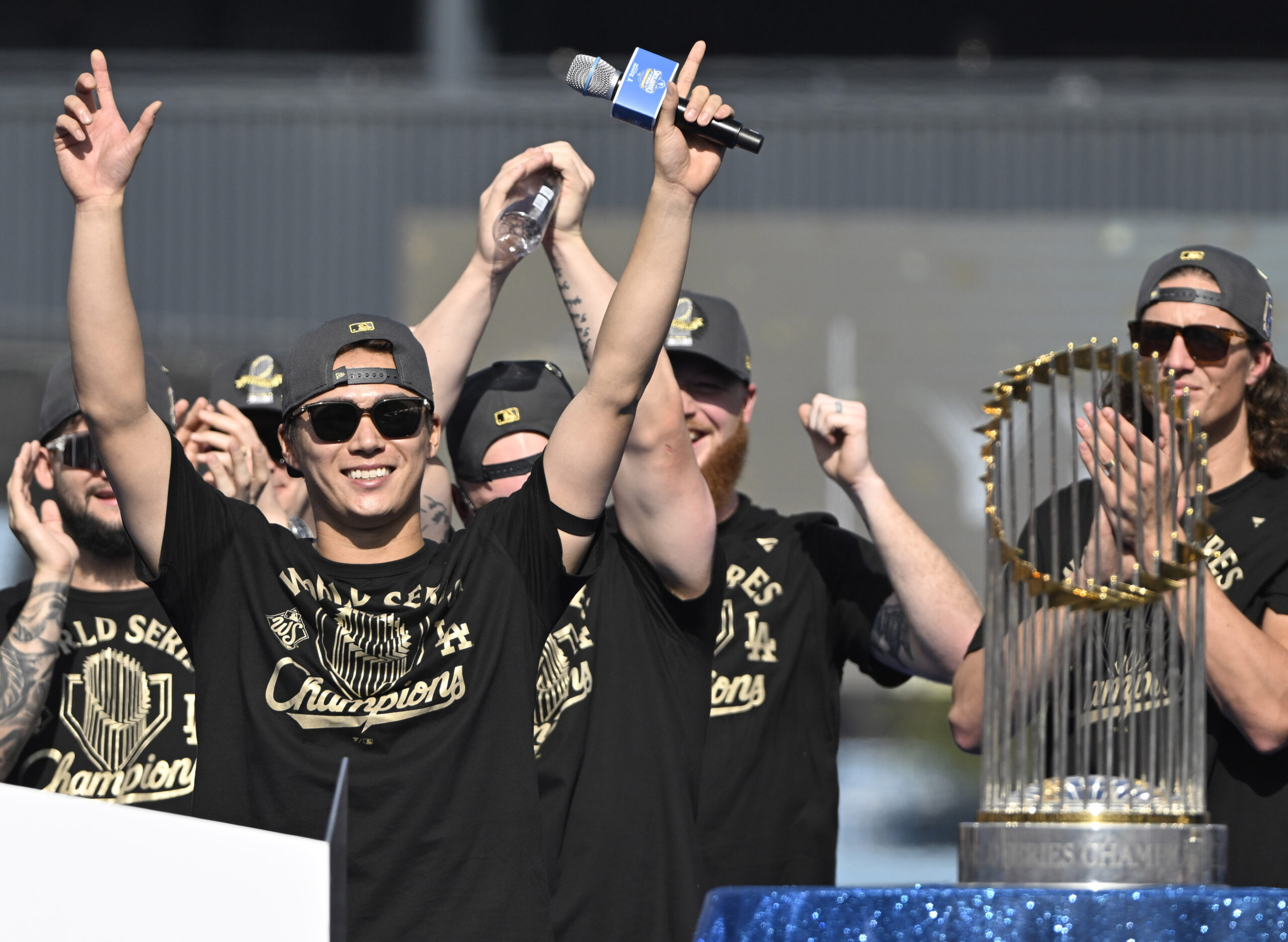 Yoshinobu Yamamoto of the Los Angeles Dodgers reacts to cheers...