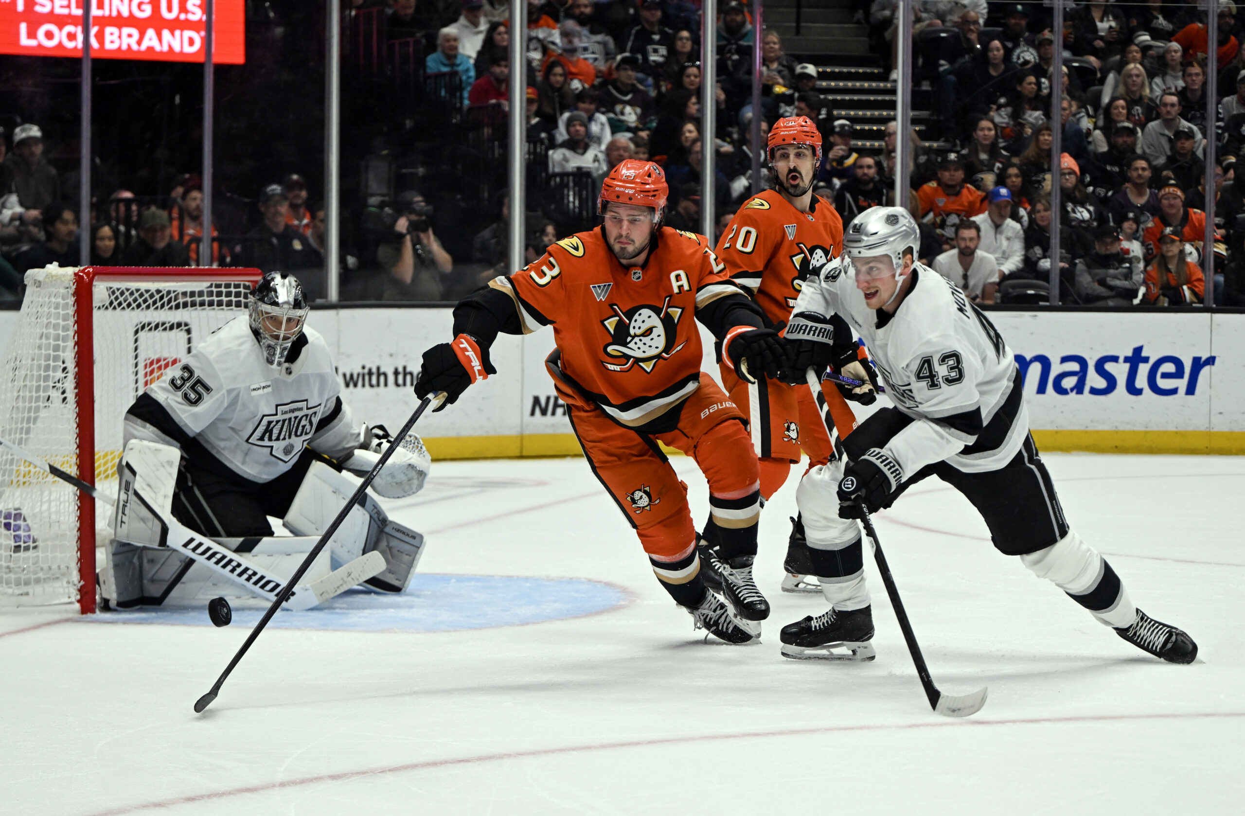 The Ducks’ Mason McTavish (23) and the Kings’ Jacob Moverare...