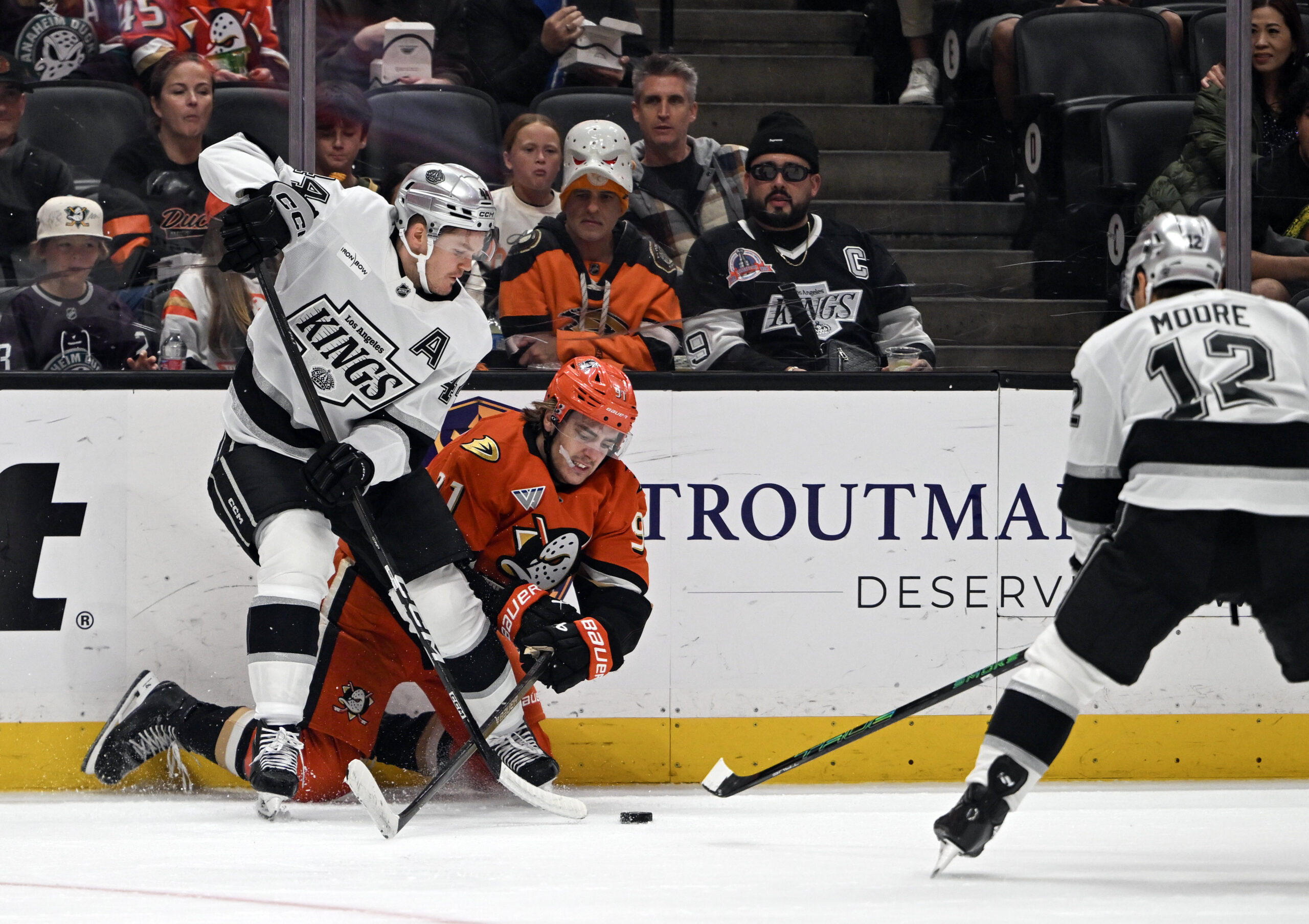 The Ducks’ Leo Carlsson (91) and the Kings’ Jacob Moverare...