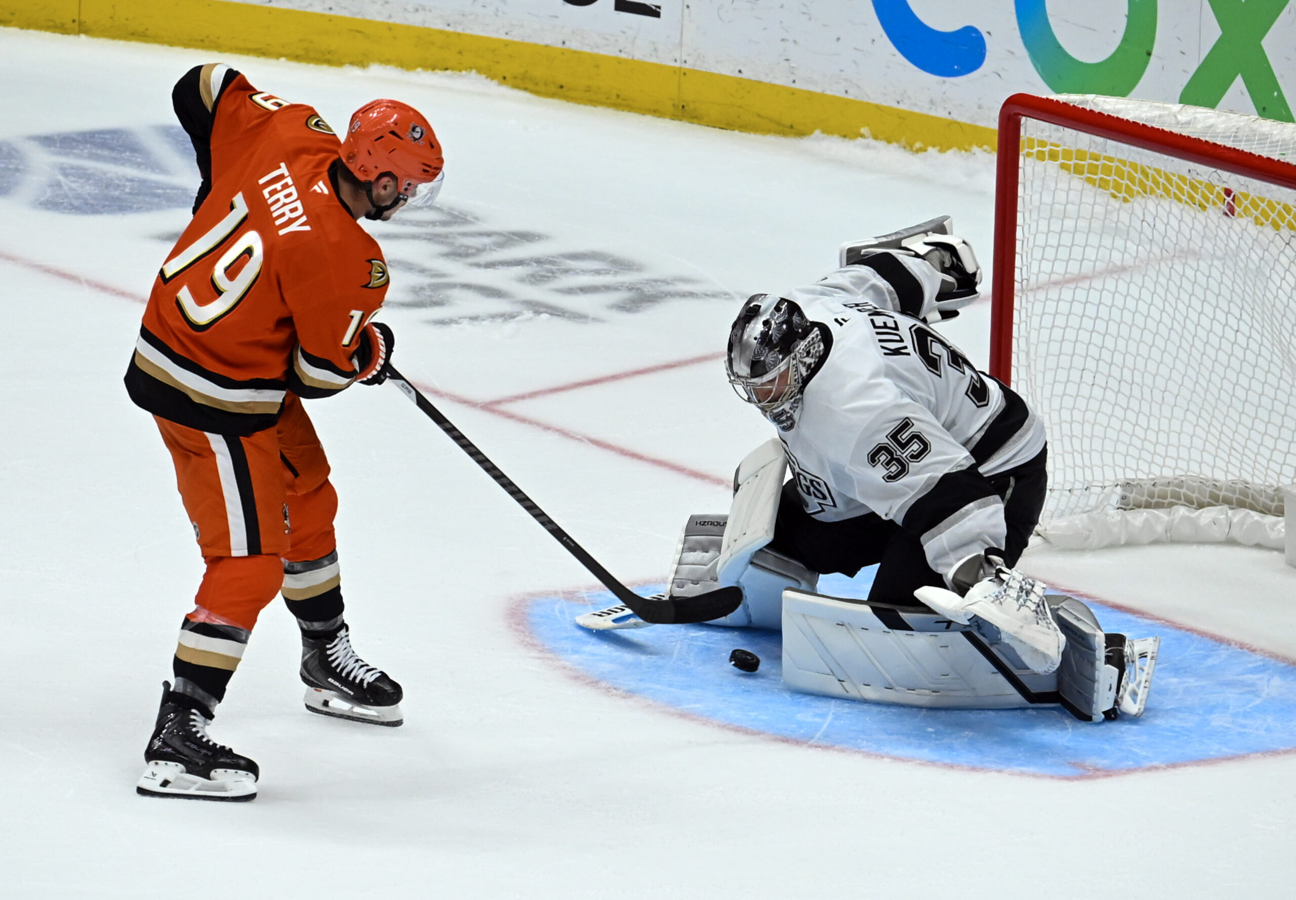 The Ducks’ Troy Terry, left, gets a shot past Kings...