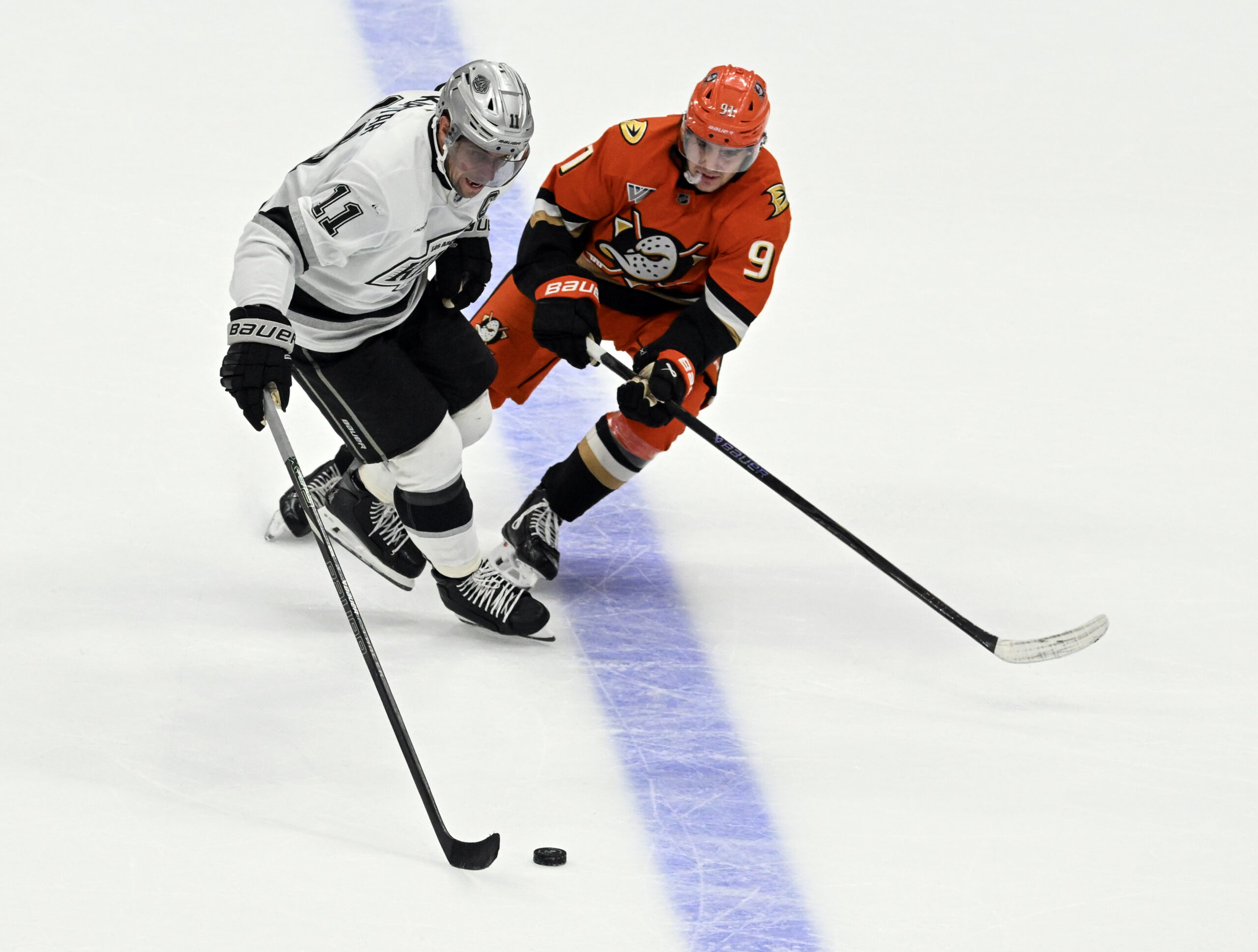 The Ducks’ Leo Carlsson, right, and the Kings’ Anze Kopitar...