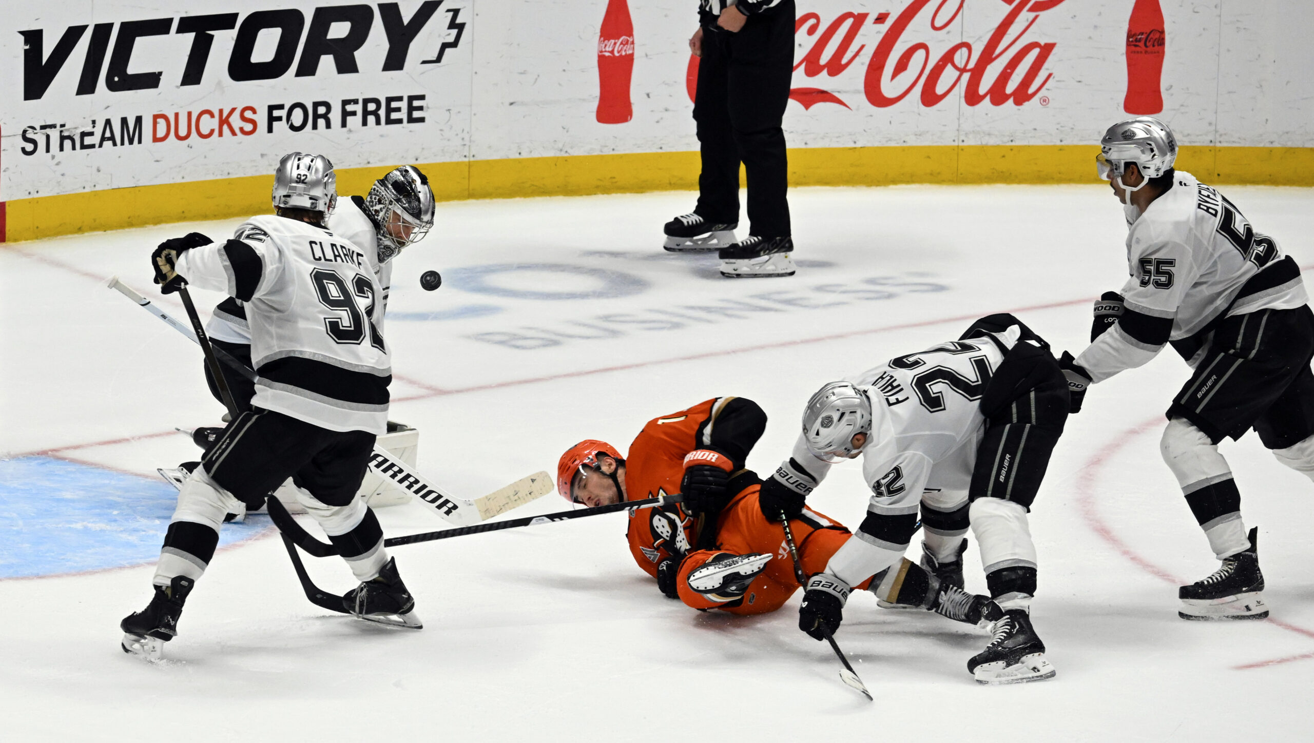 The Ducks’ Troy Terry (19) falls to the ice as...