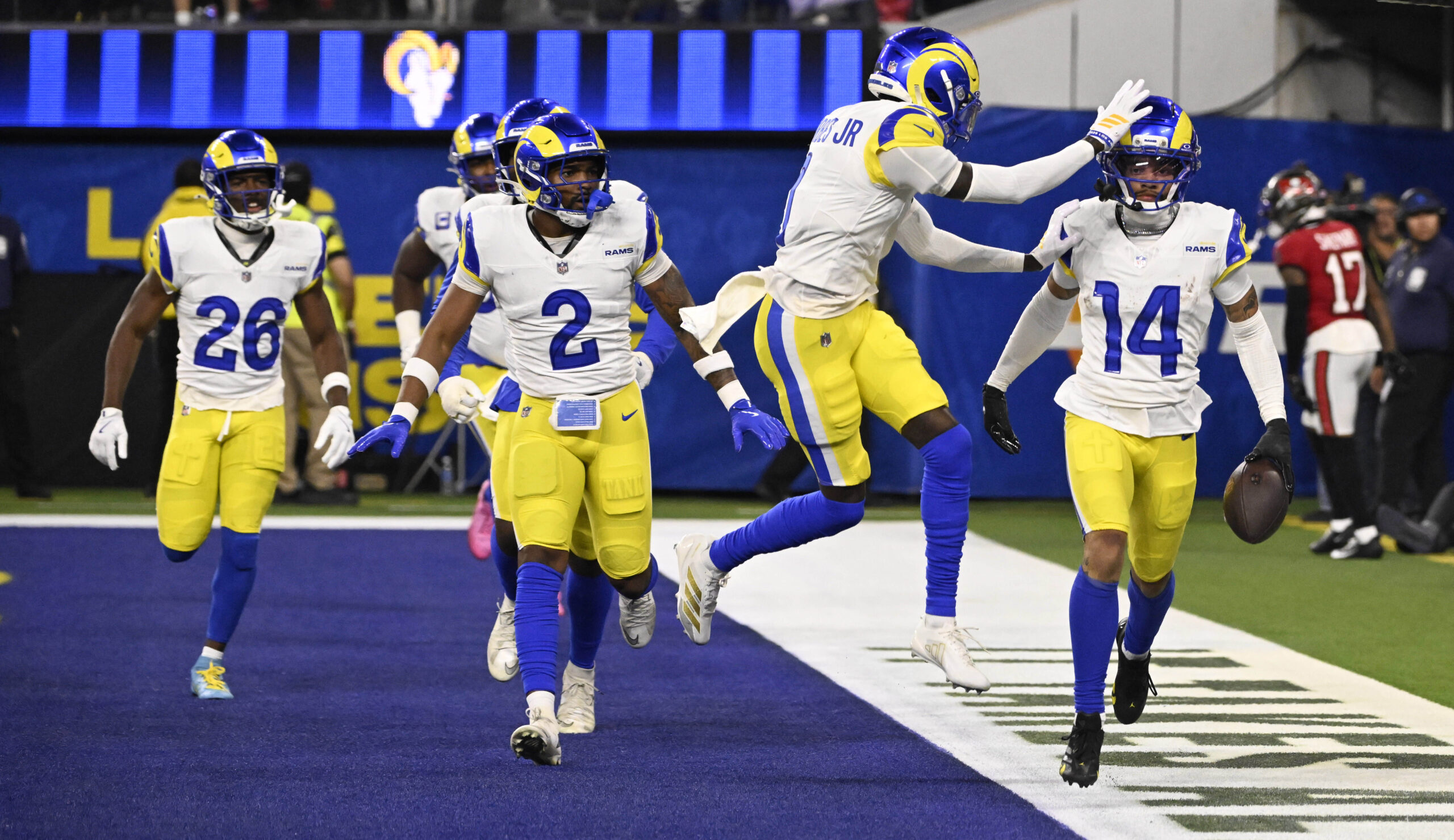 Cornerback Cobie Durant (14) of the Rams celebrates with teammates...