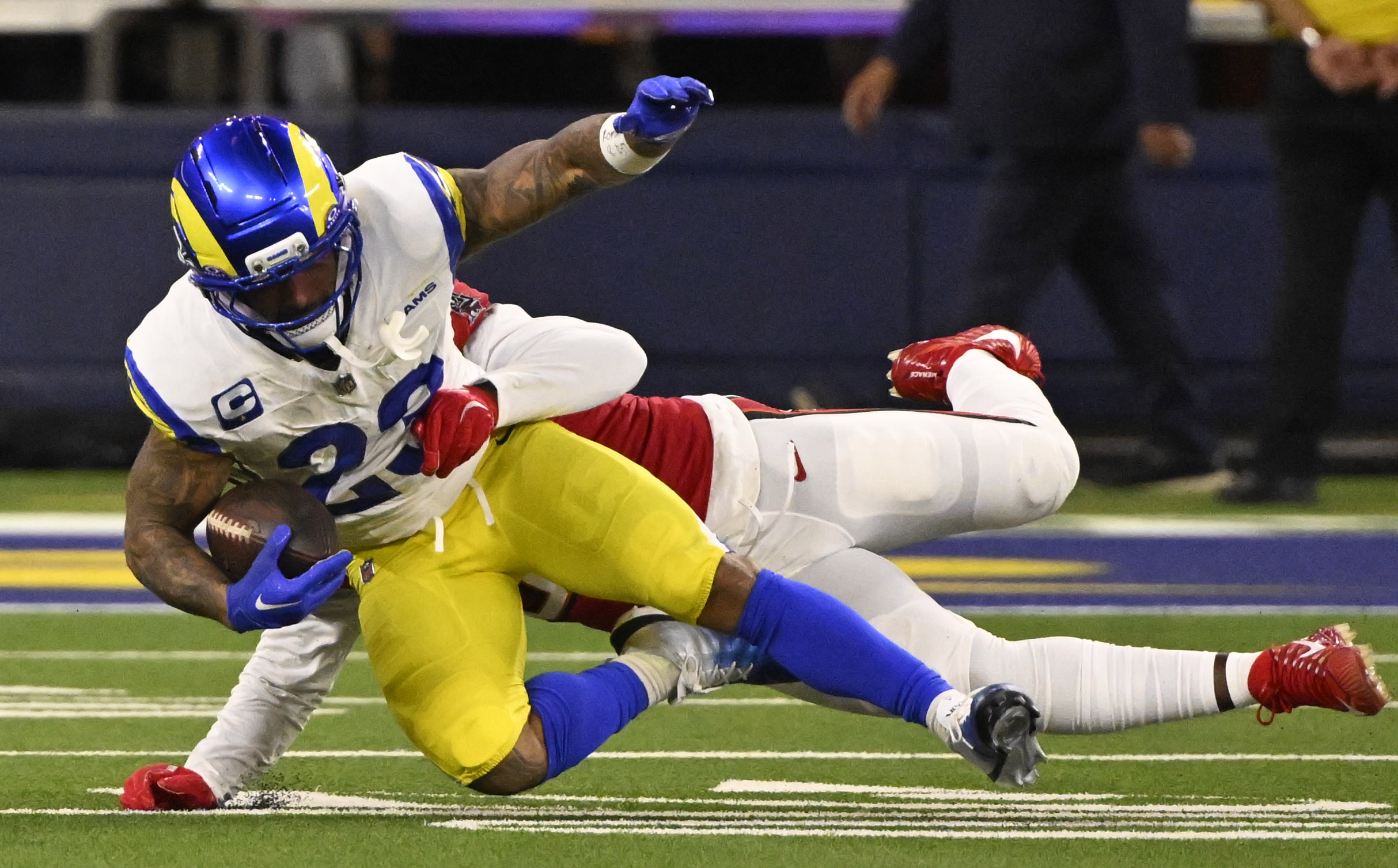 Running back Kyren Williams (23) of the Rams runs for...