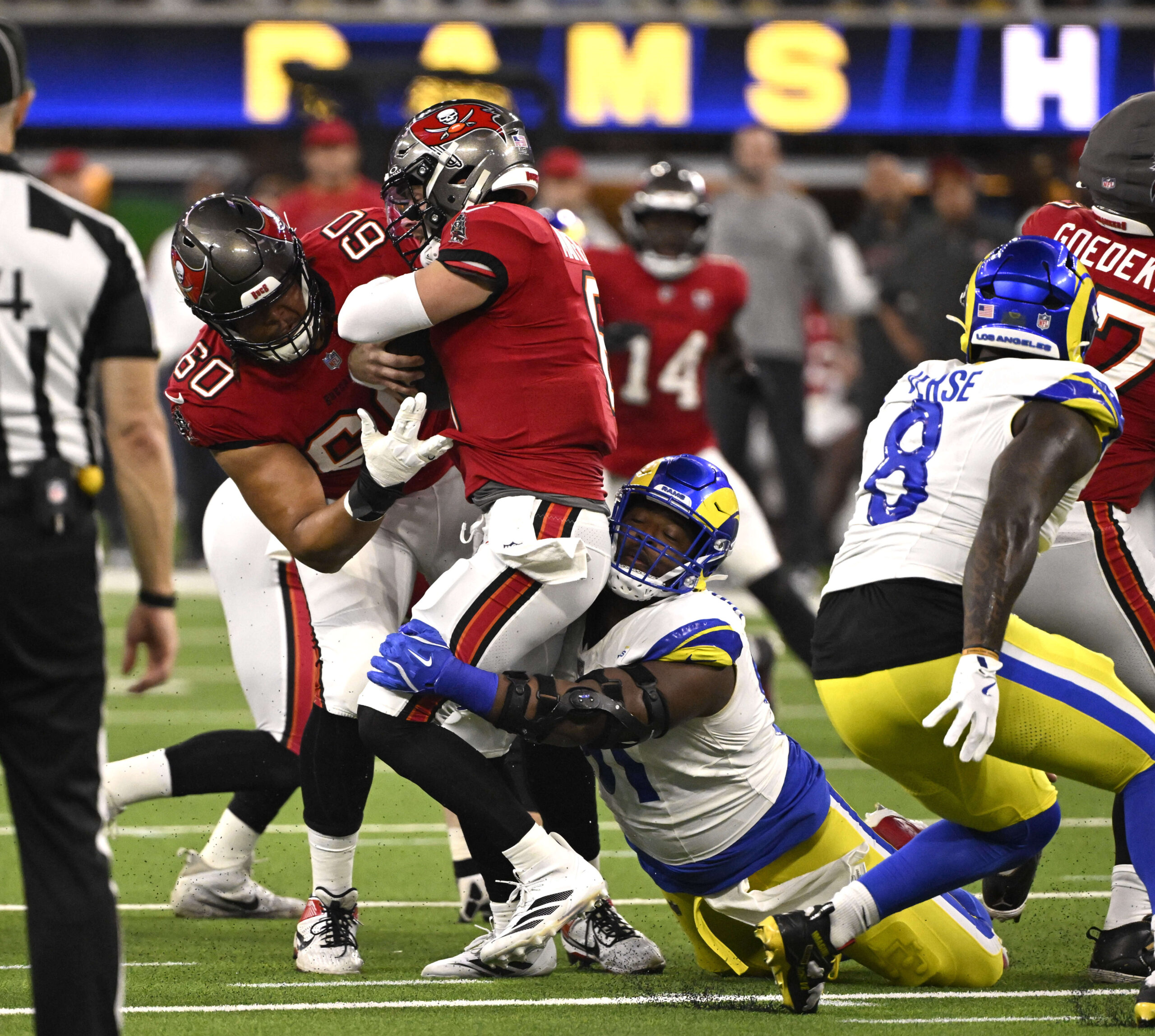 Defensive end Kobie Turner (91) of the Rams sacks quarterback...
