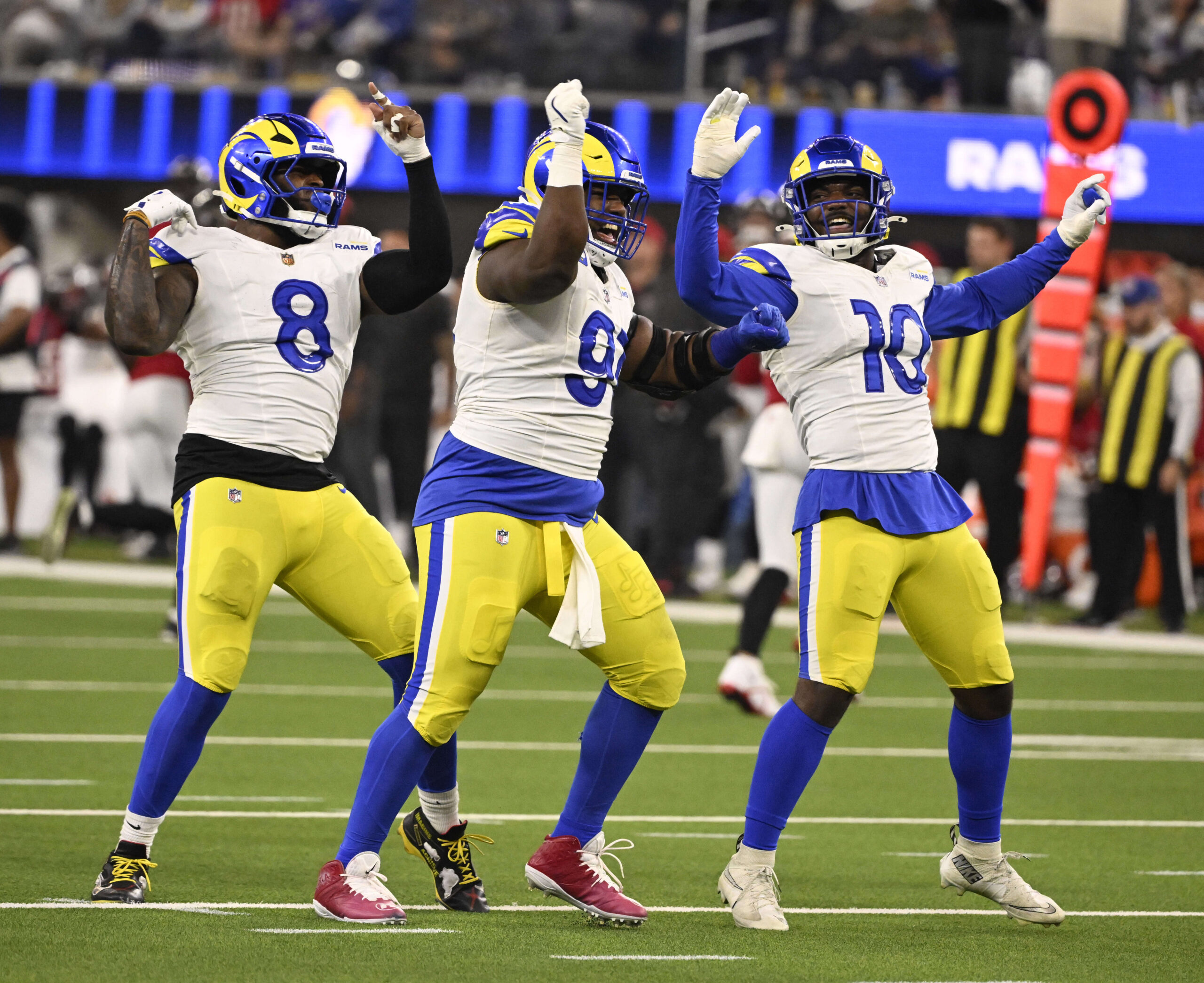 Defensive end Kobie Turner (91) reacts with teammates linebacker Jared...