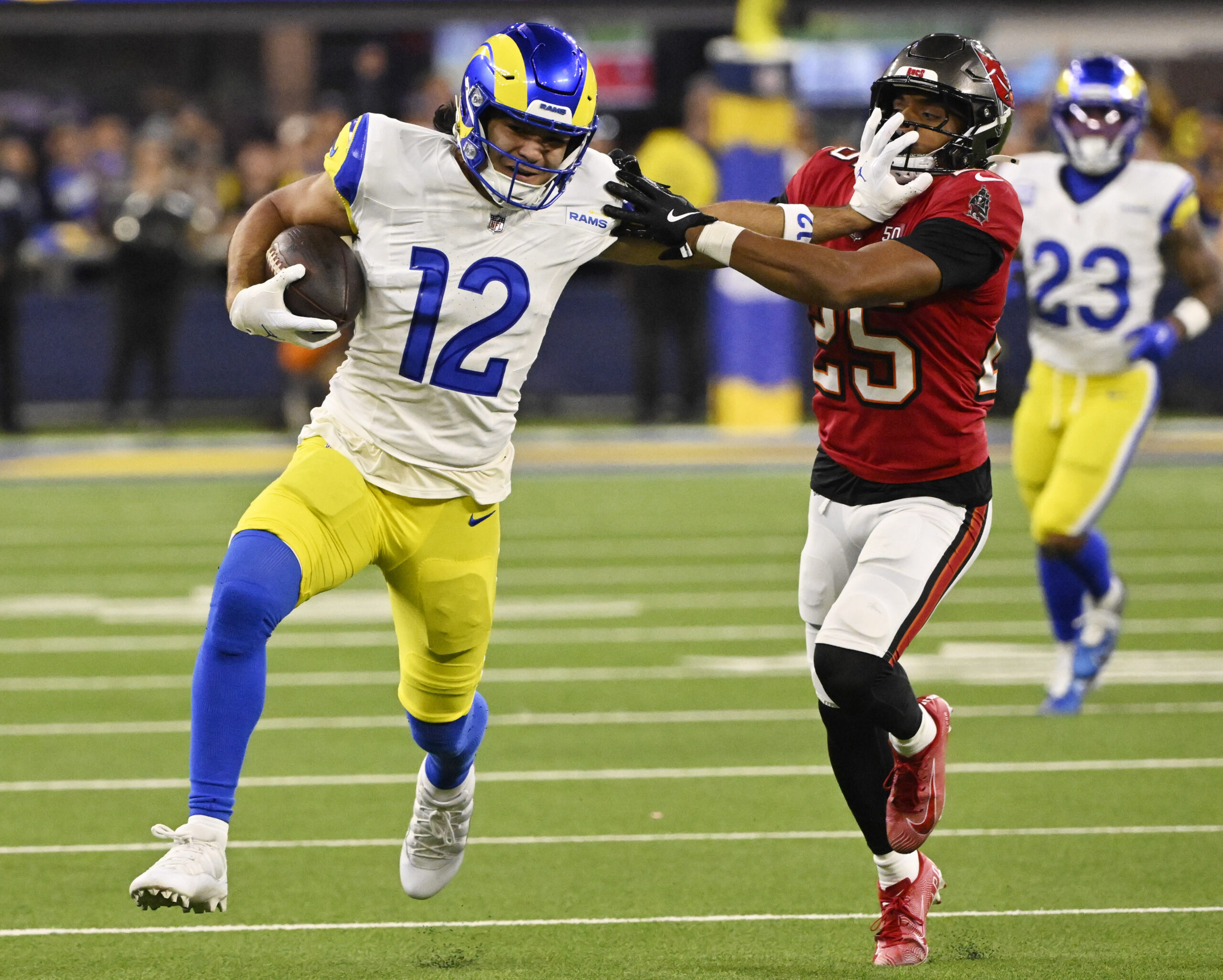 Wide receiver Puka Nacua (12) of the Rams catches a...