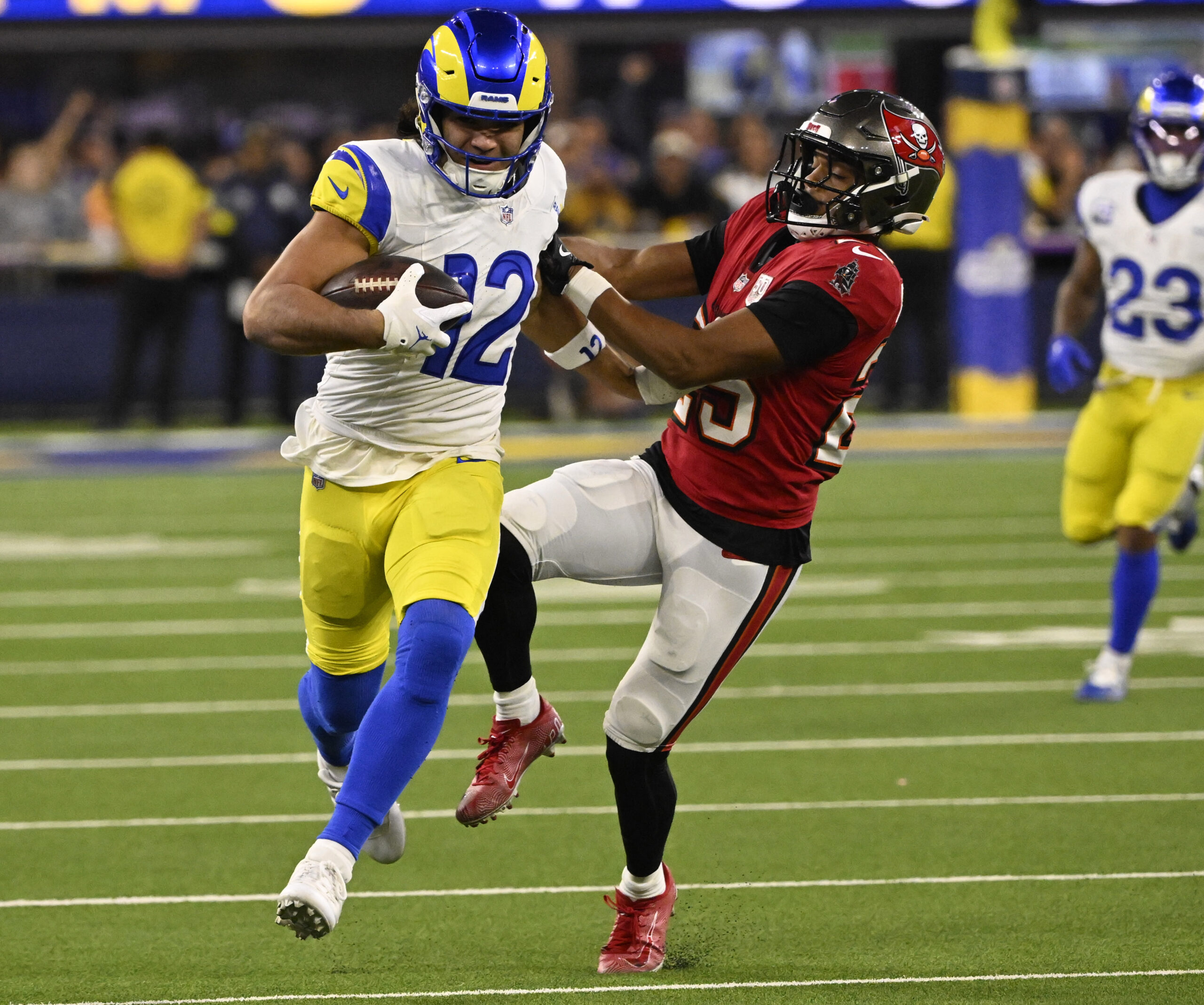 Wide receiver Puka Nacua (12) of the Rams catches a...
