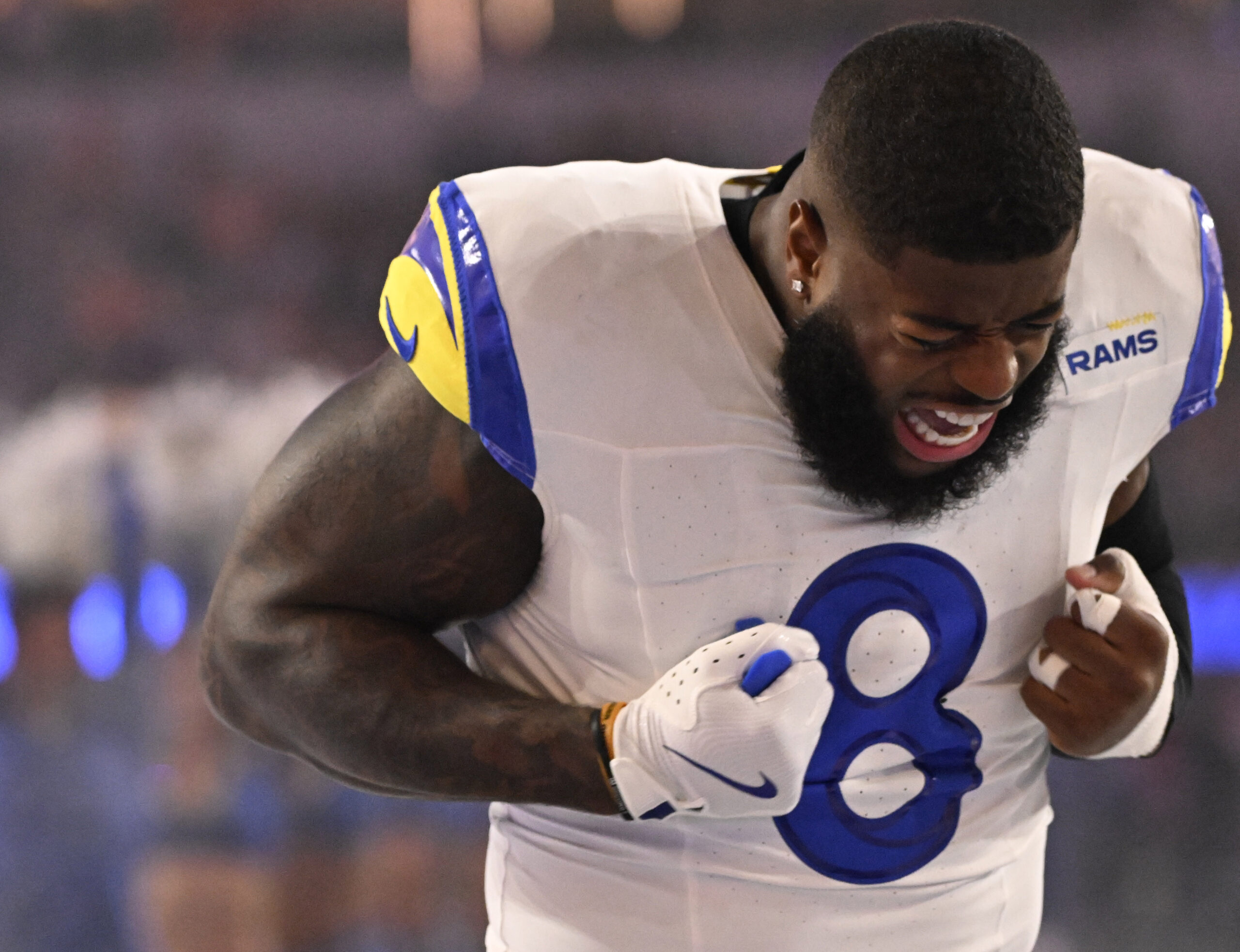 Linebacker Jared Verse (8) of the Rams reacts afer being...