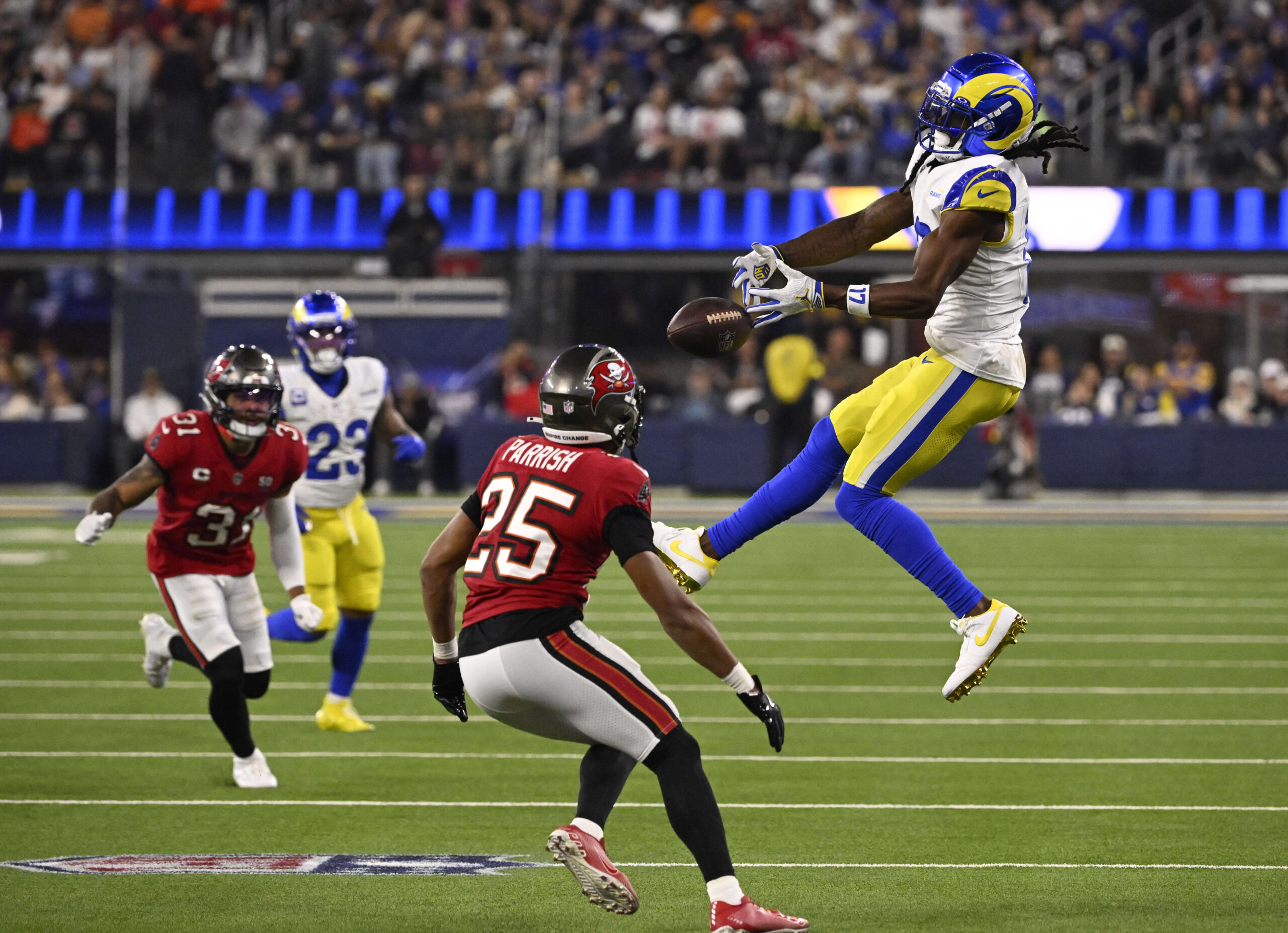 Wide receiver Davante Adams (17) of the Rams drops a...