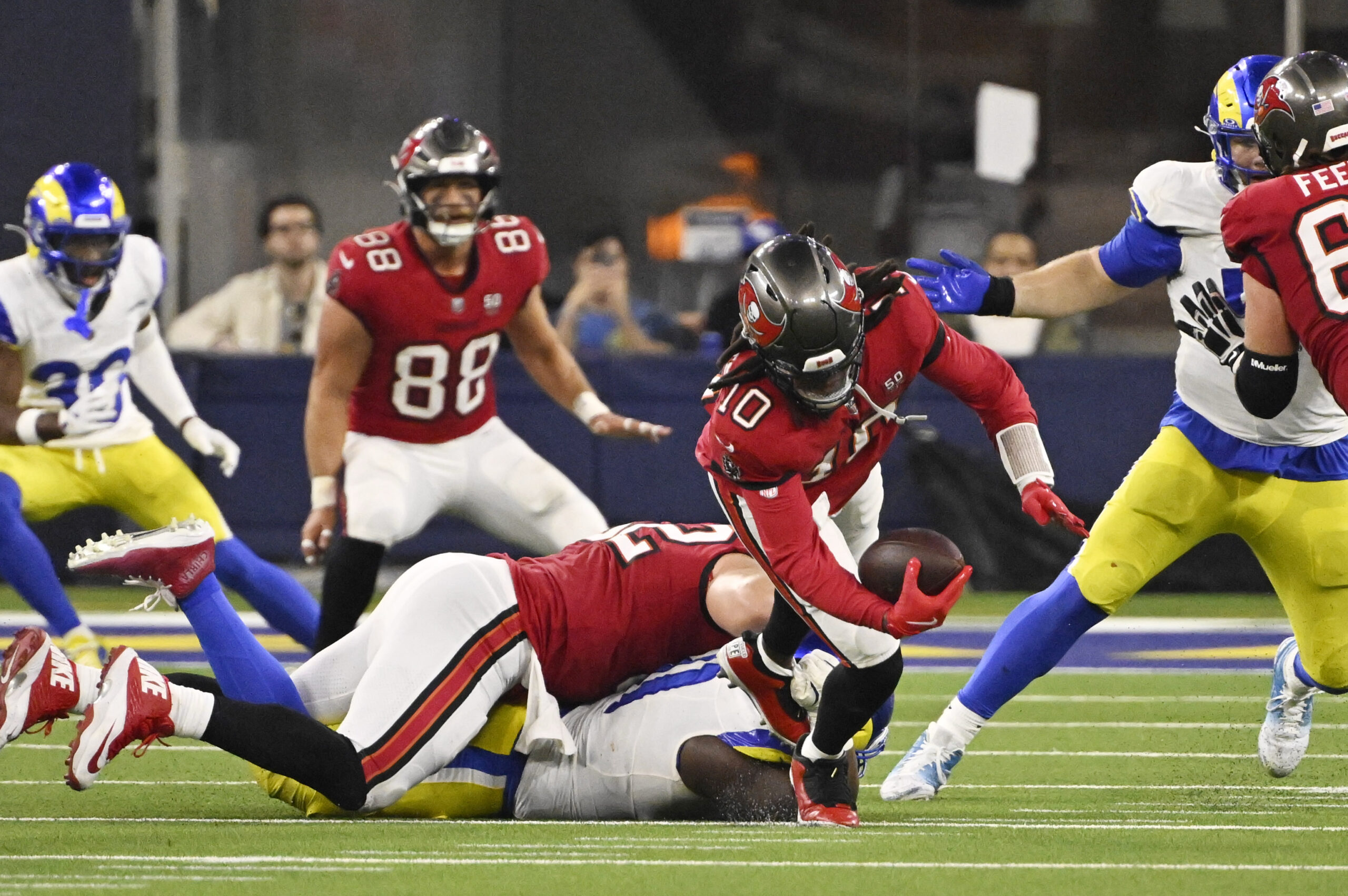 Defensive end Kobie Turner (91) of the Rams sacks quarterback...