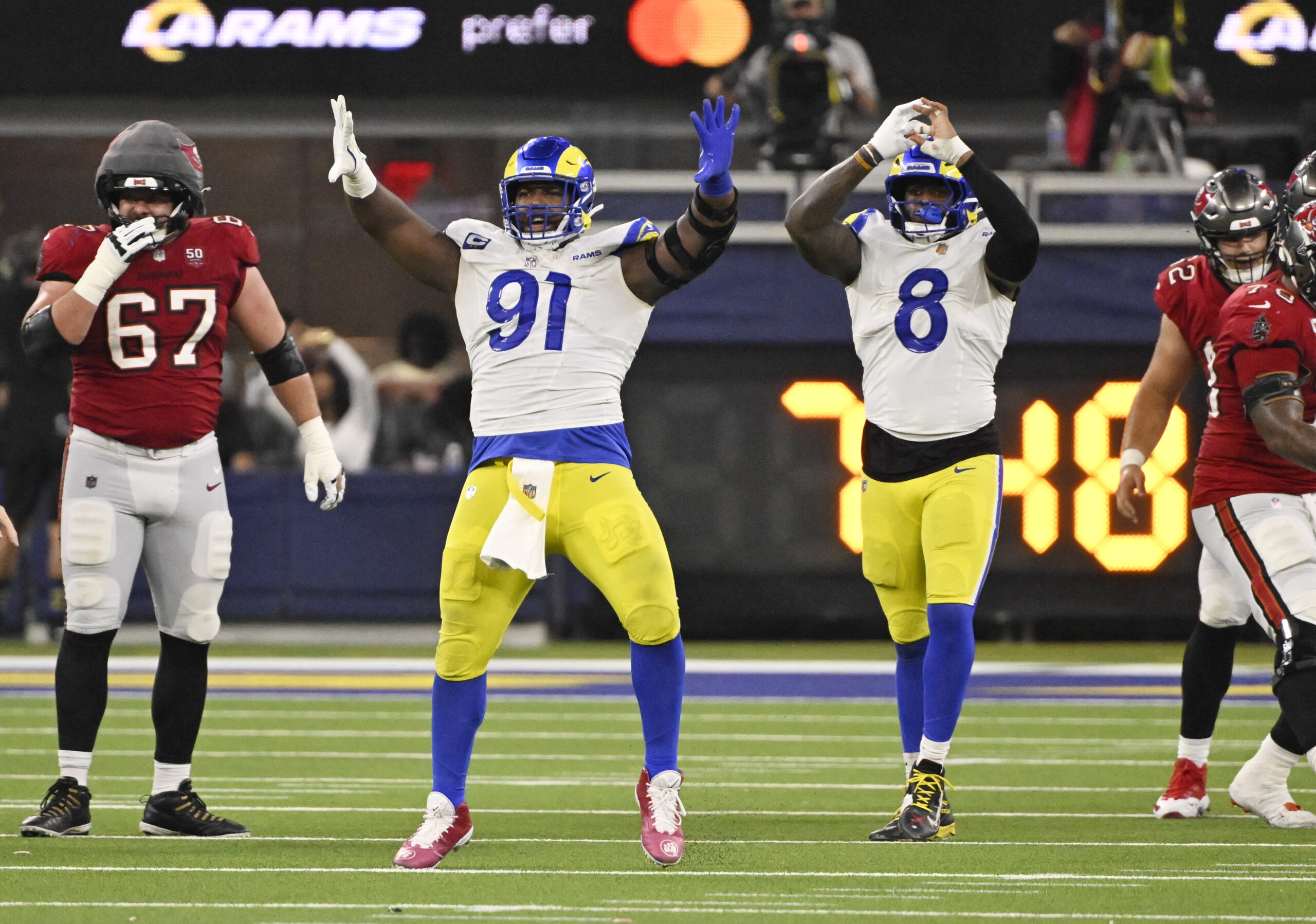 Defensive end Kobie Turner (91) of the Rams reacts with...