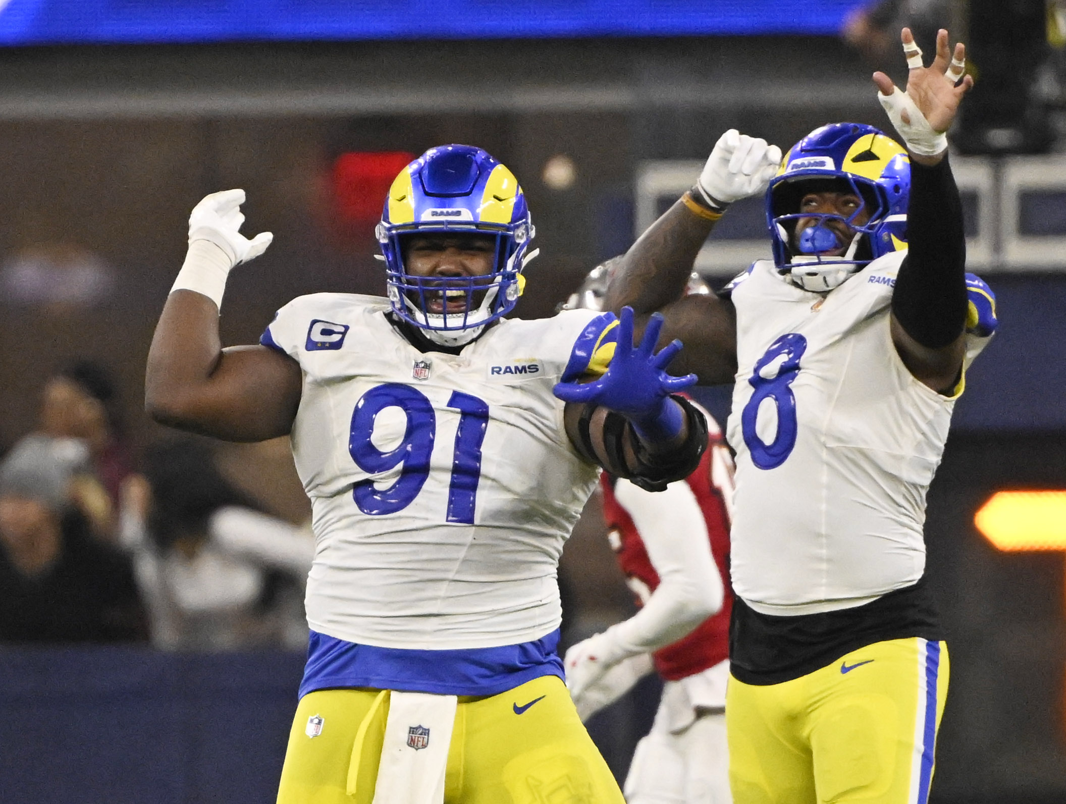 Defensive end Kobie Turner (91) of the Rams reacts with...