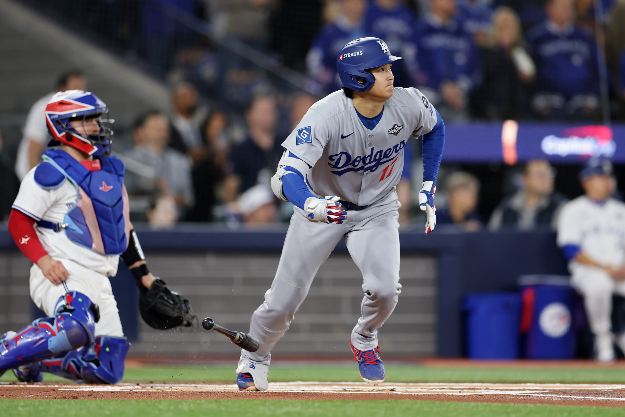 Dodgers star Shohei Ohtani begins to run after hitting a...