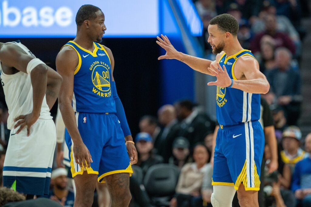 Dec 6, 2024; San Francisco, California, USA; Golden State Warriors guard Stephen Curry (30) speaks with forward Jonathan Kuminga (00) during a time out against the Minnesota Timberwolves during the fourth quarter at Chase Center. Mandatory Credit: Neville E. Guard-Imagn Images