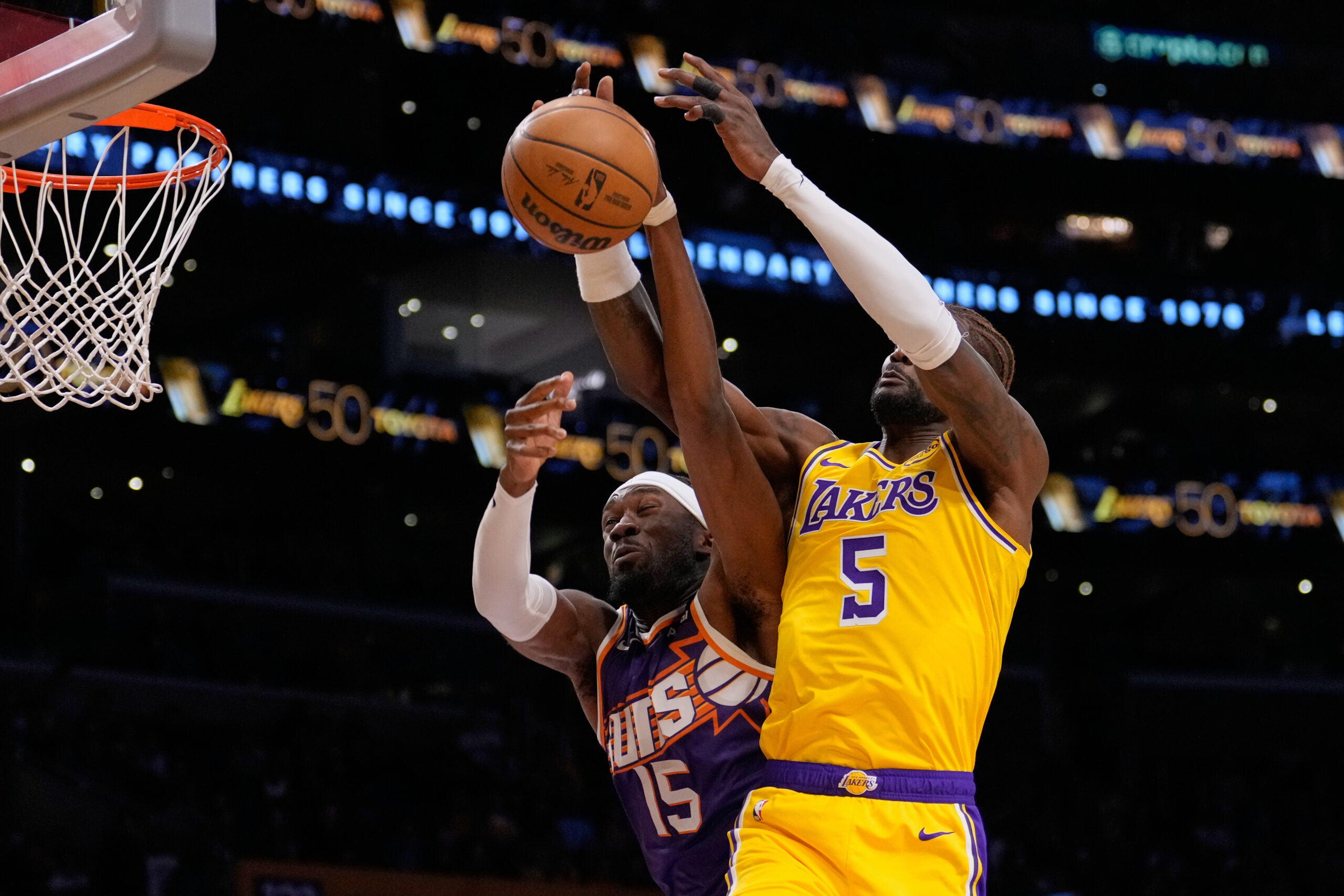 Phoenix Suns center Mark Williams, left, and Lakers center Deandre...