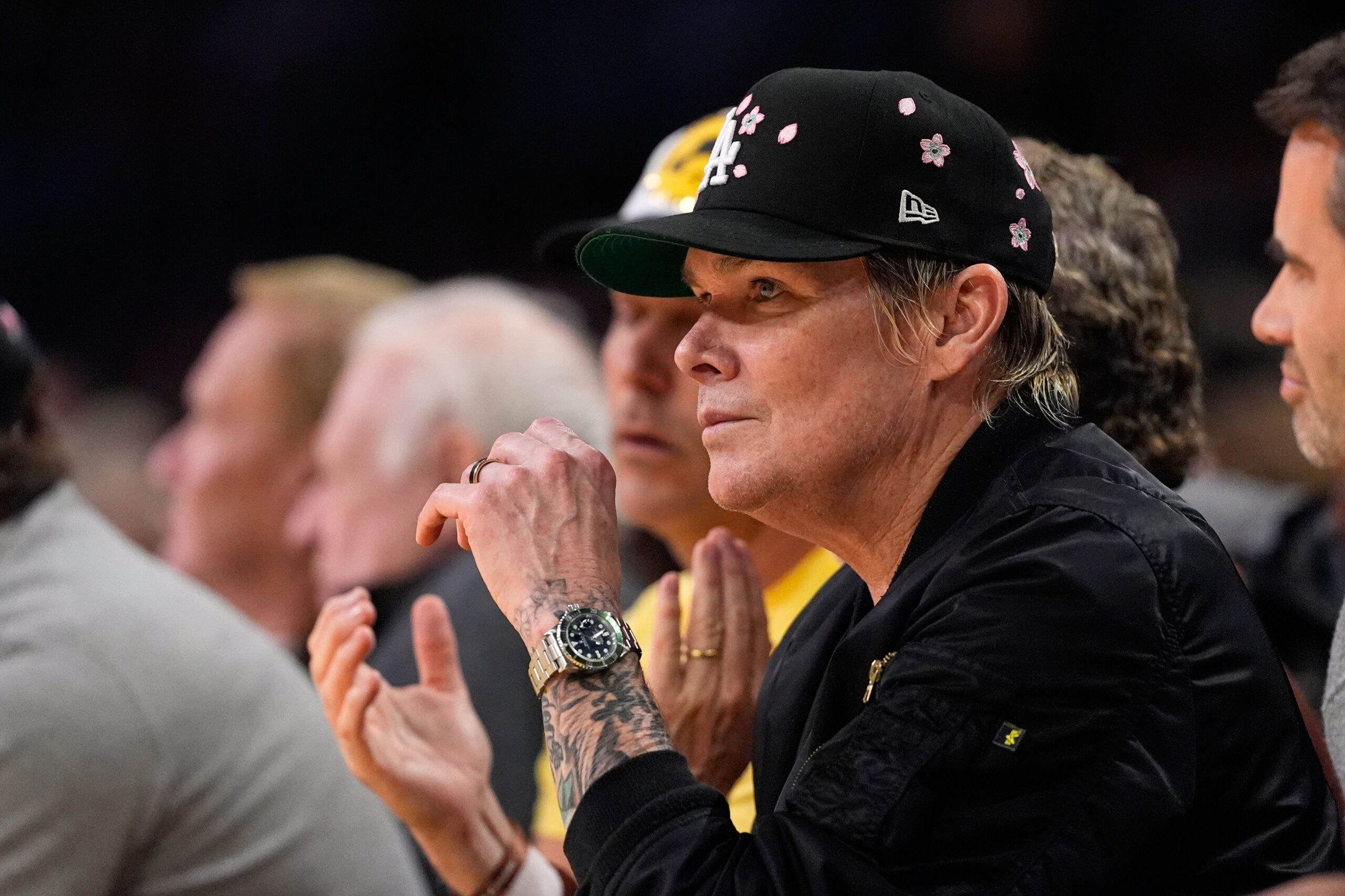 Entertainer Mark McGrath watches from a courtside seat during the...