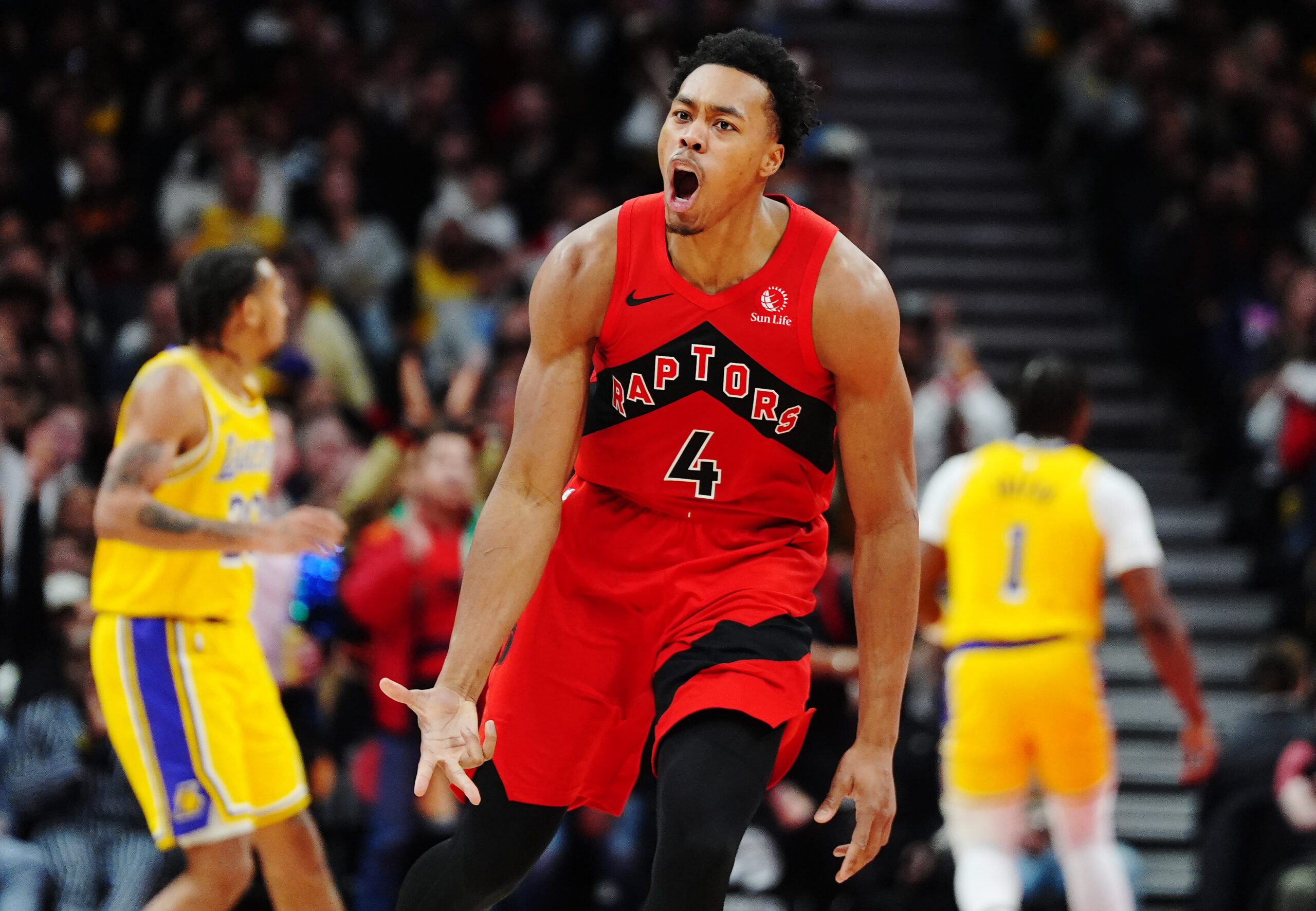 The Toronto Raptors’ Scottie Barnes celebrates after a basket during...
