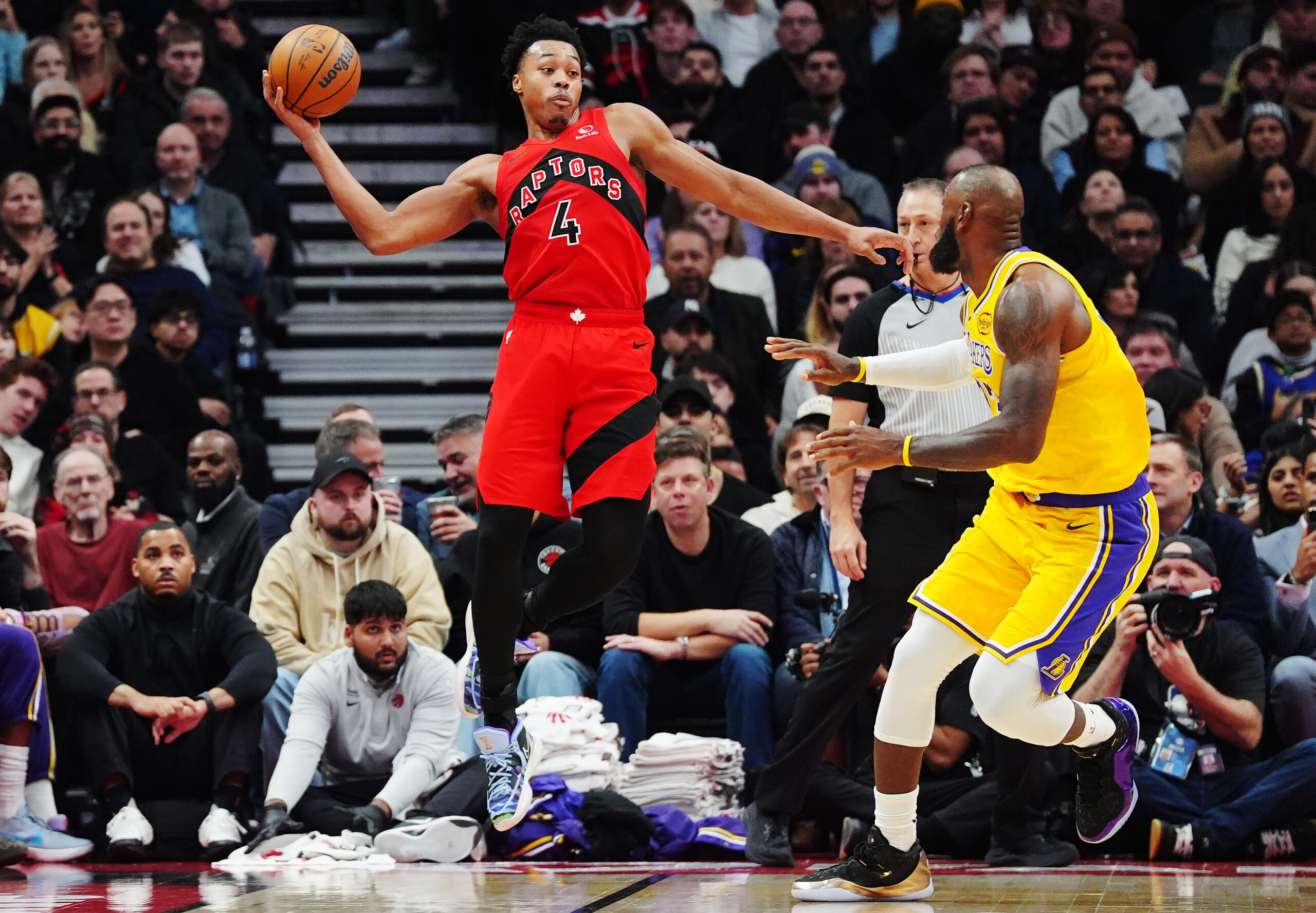 The Toronto Raptors’ Scottie Barnes looks to pass the ball...