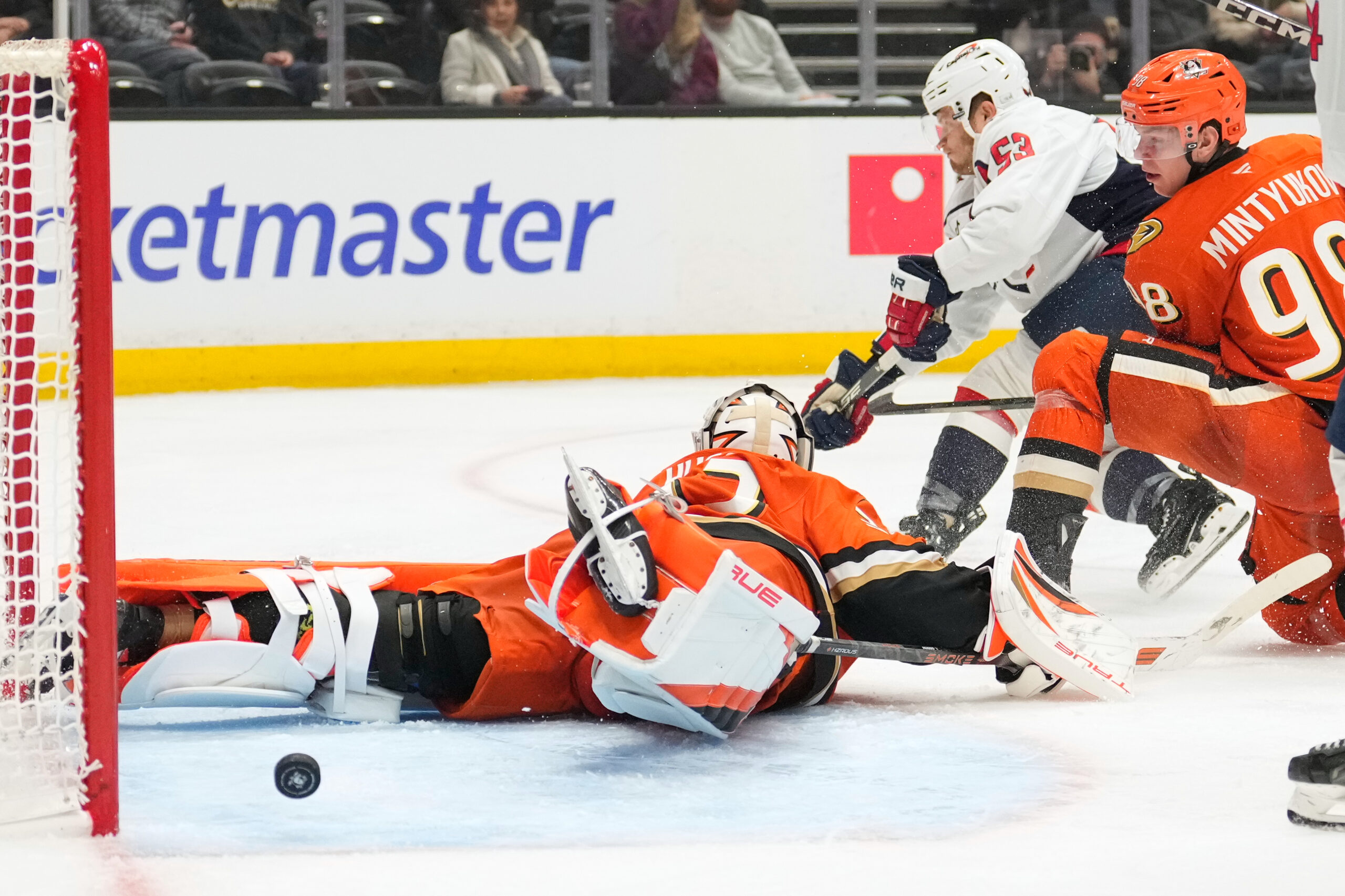 Washington Capitals center Ethen Frank, center, scores on Ducks goaltender...