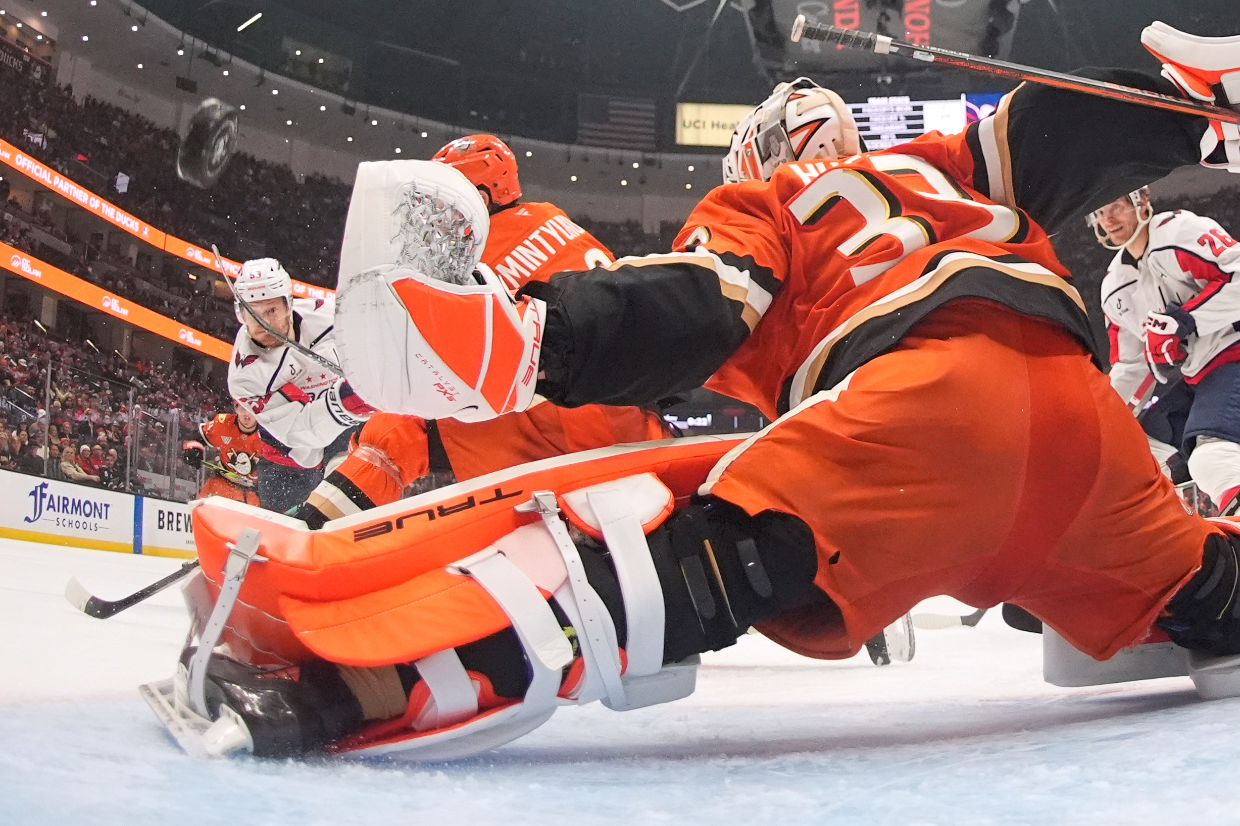 Washington Capitals center Ethen Frank, left, scores on Ducks goaltender...