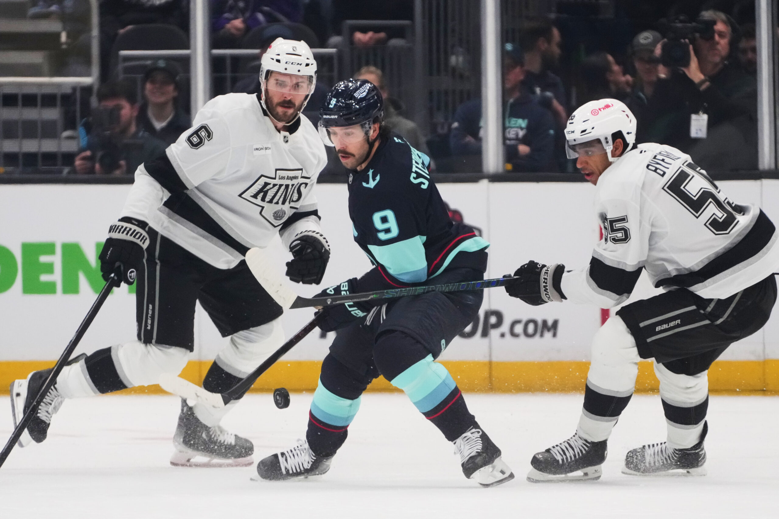 Seattle Kraken center Chandler Stephenson (9) looks back at the...