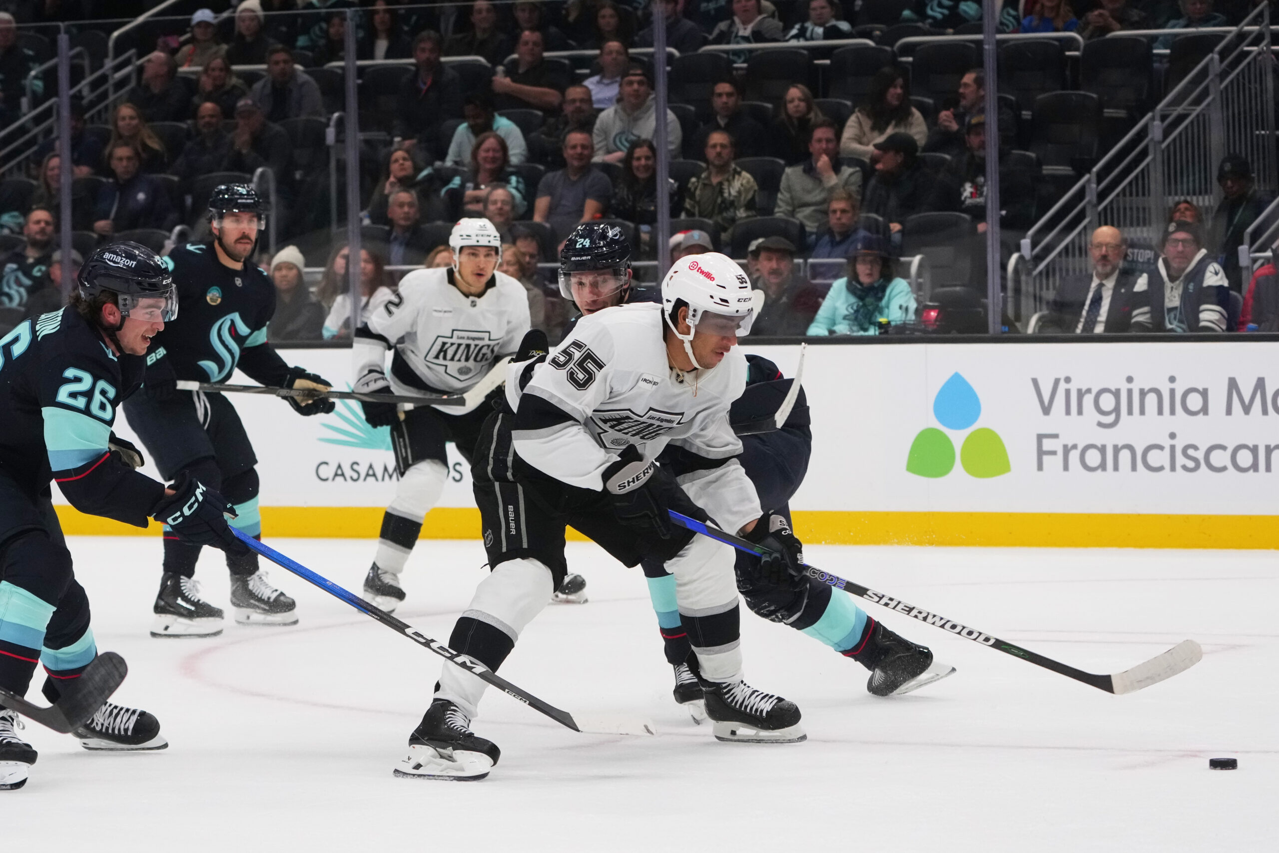 Kings right wing Quinton Byfield (55) pushes past Seattle Kraken...