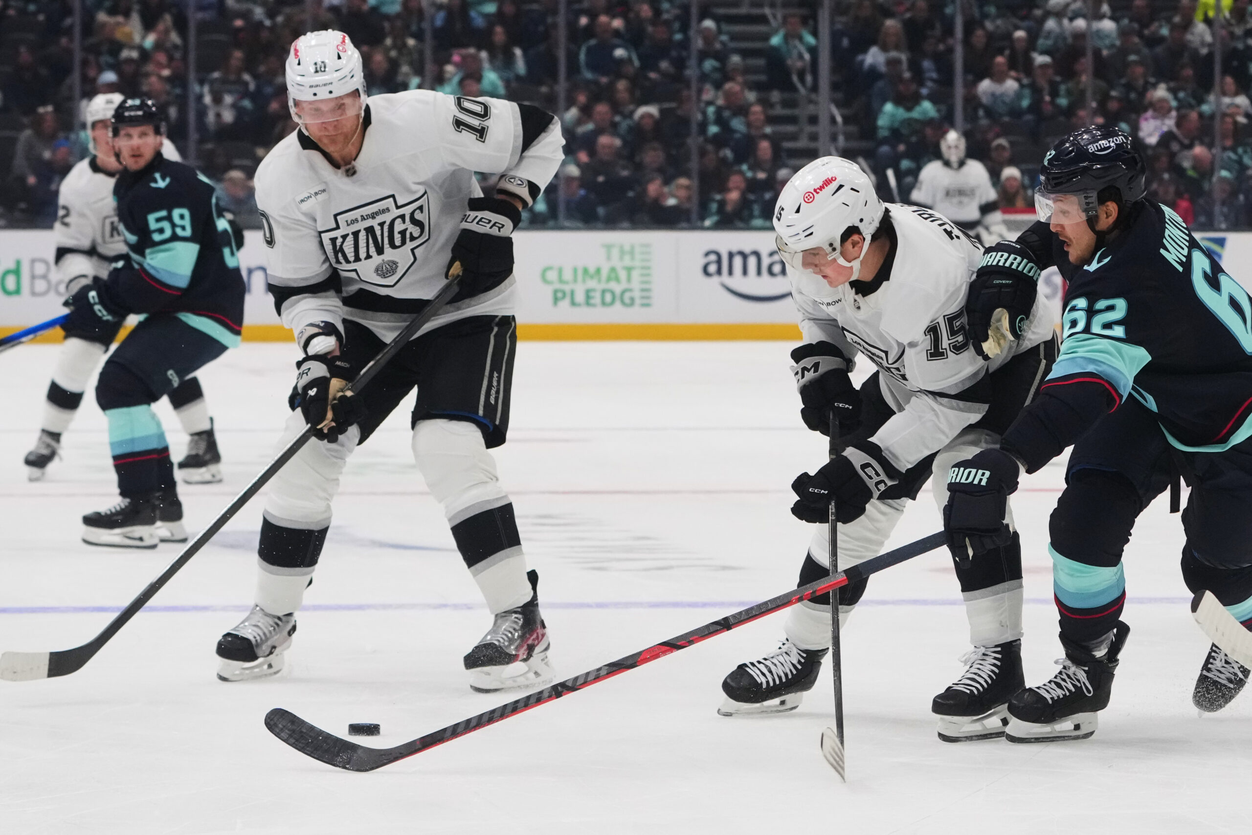 Kings right wing Corey Perry (10) looks to pick up...