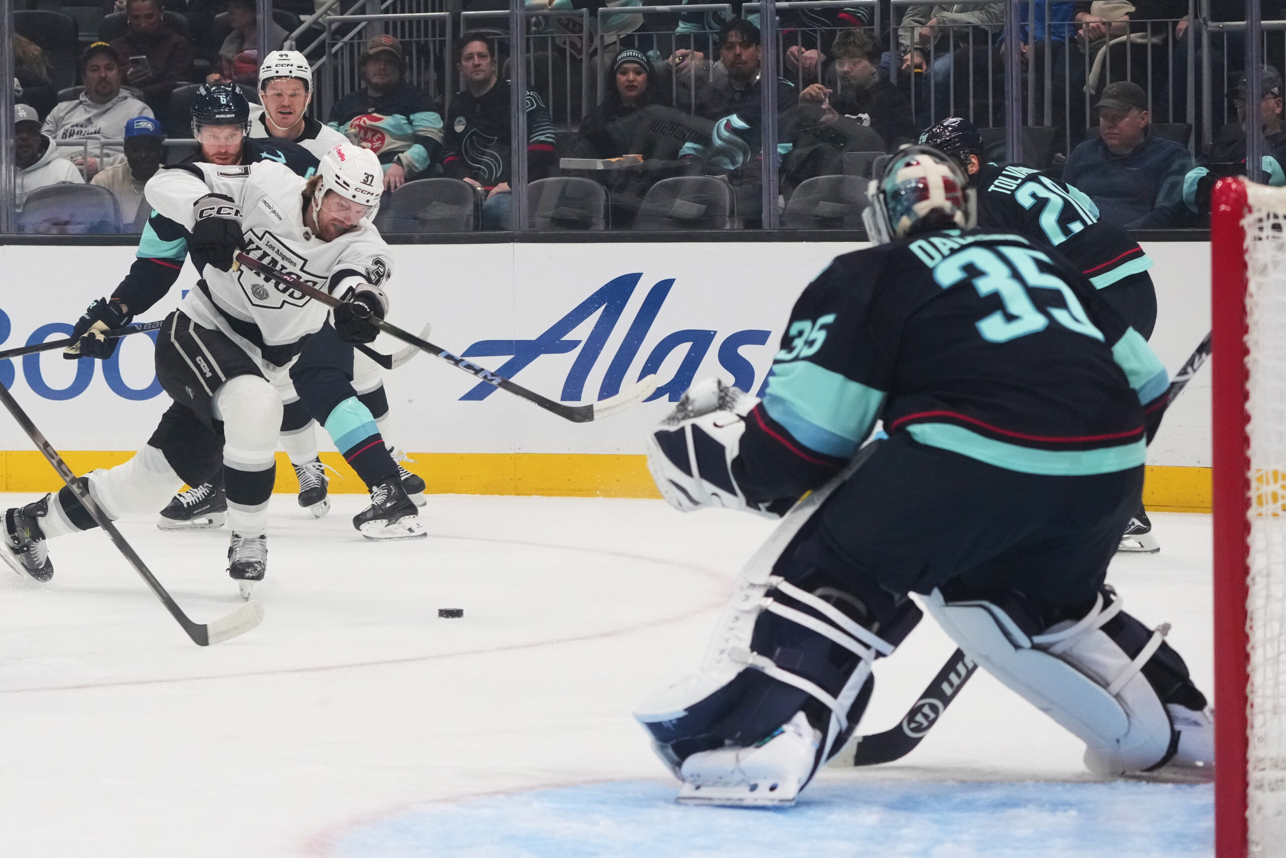 Kings left wing Warren Foegele (37) shoots against Seattle Kraken...