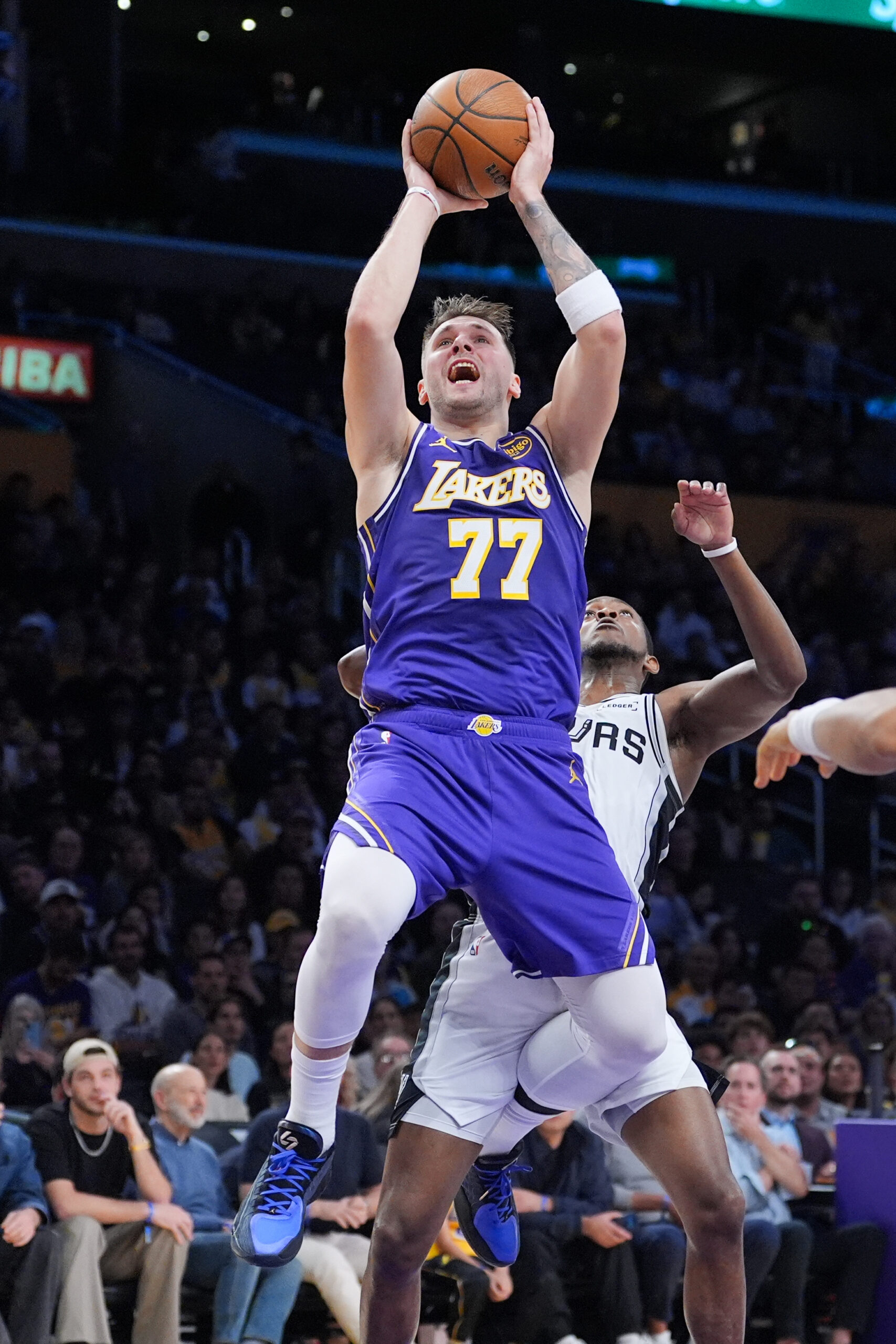 Lakers guard Luka Doncic shoots during the first half of...