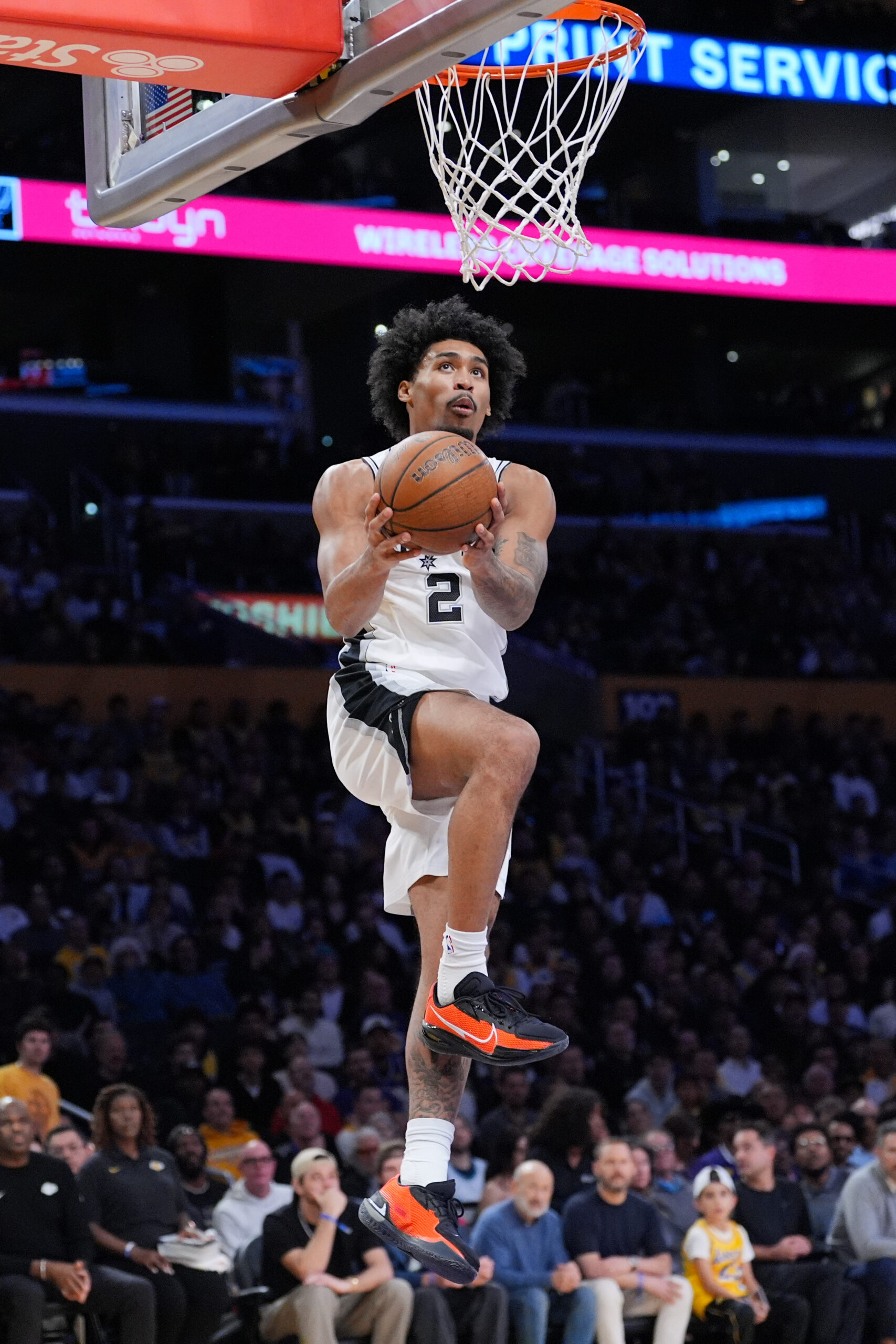 San Antonio Spurs guard Dylan Harper gets to the basket...