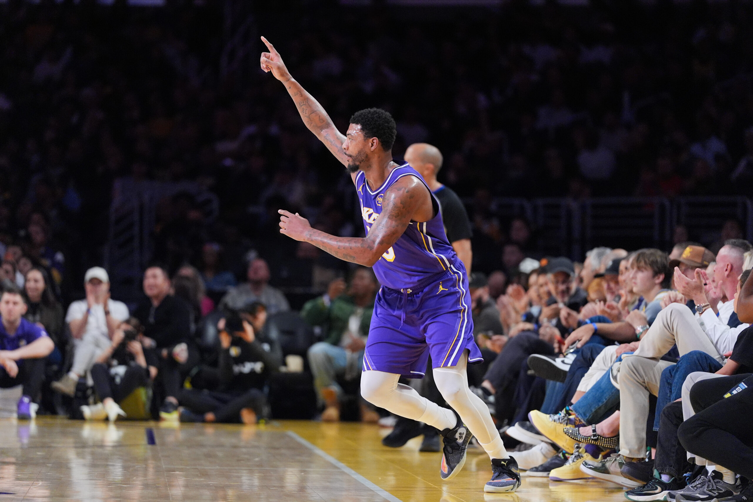 Lakers guard Marcus Smart celebrates after making a 3-point shot...