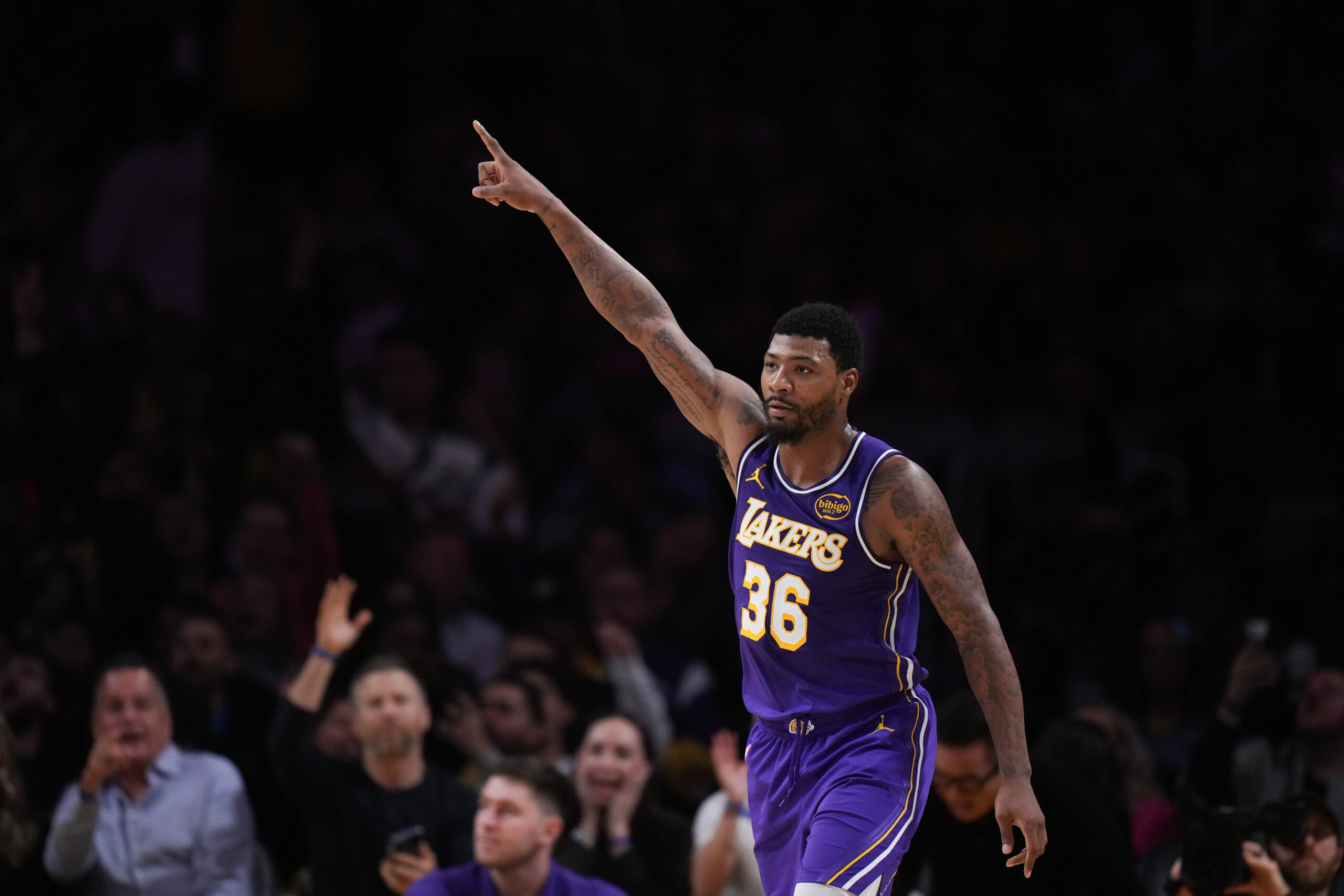 Lakers guard Marcus Smart celebrates after making a 3-point shot...