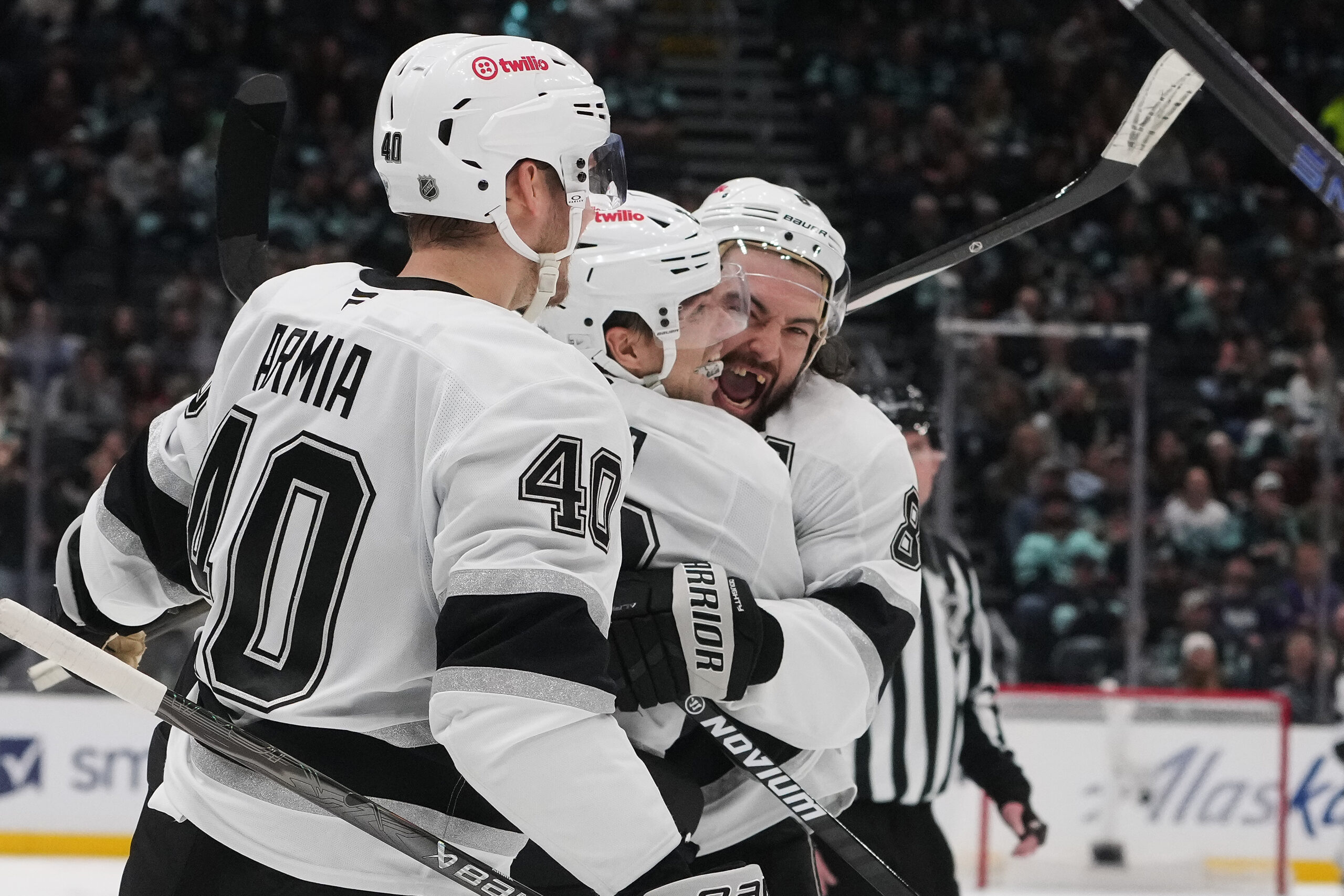 Kings left wing Kevin Fiala, center, celebrates his goal with...