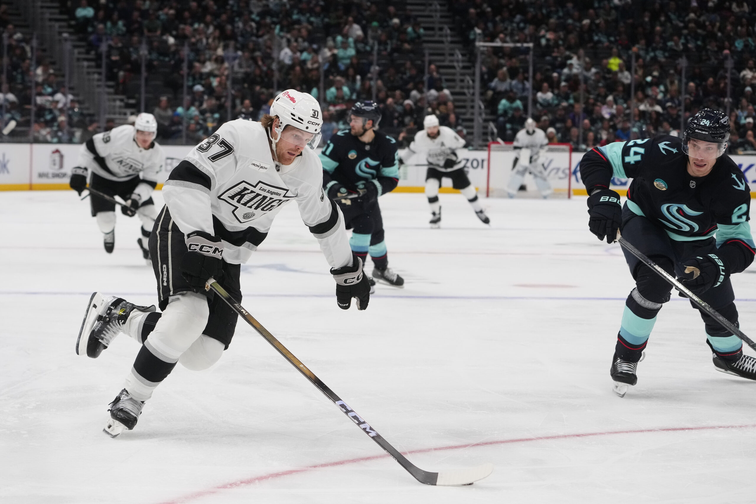 Kings left wing Warren Foegele (37) moves the puck against...