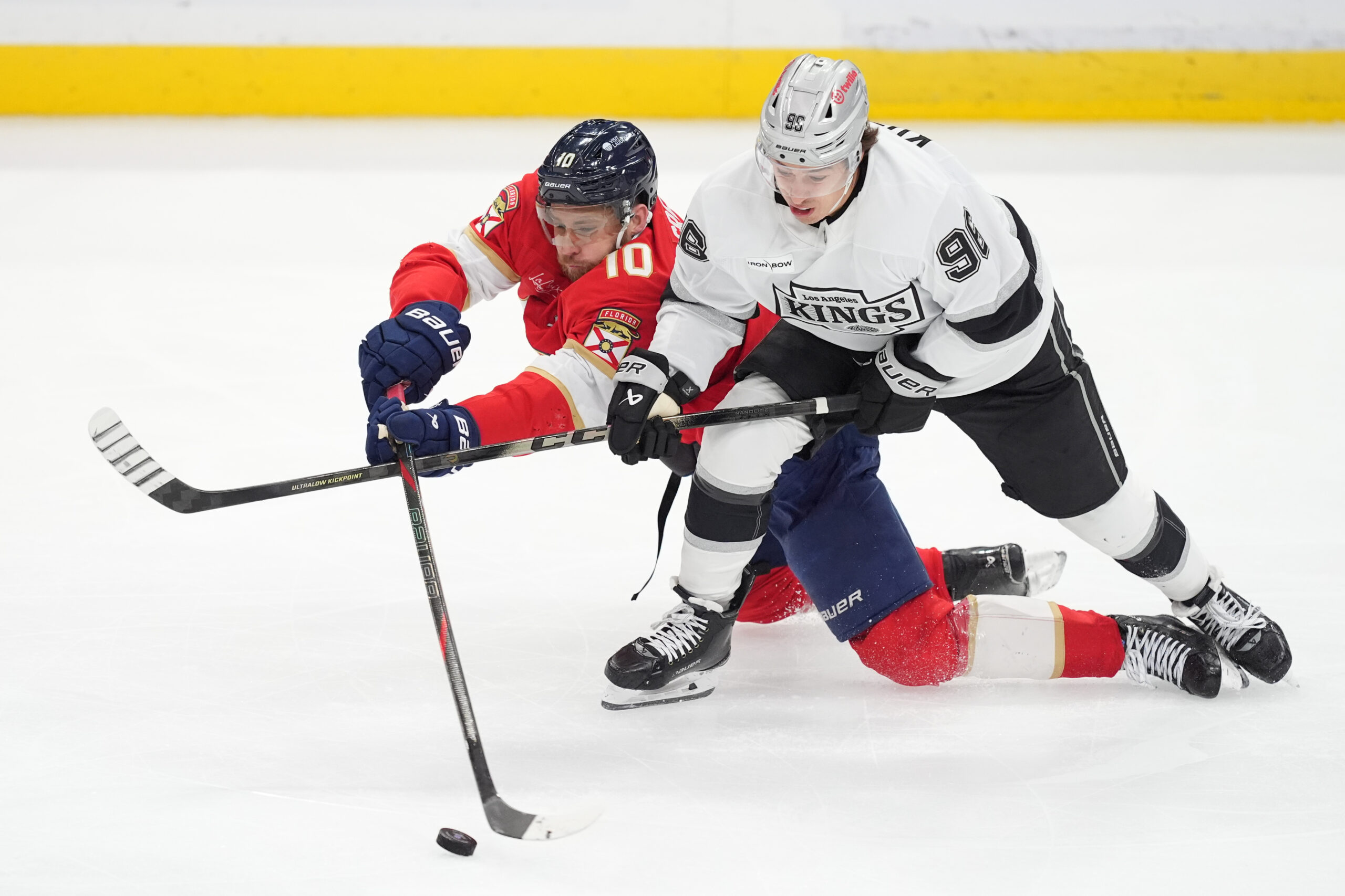 Florida Panthers left wing A.J. Greer, left, vies for the...