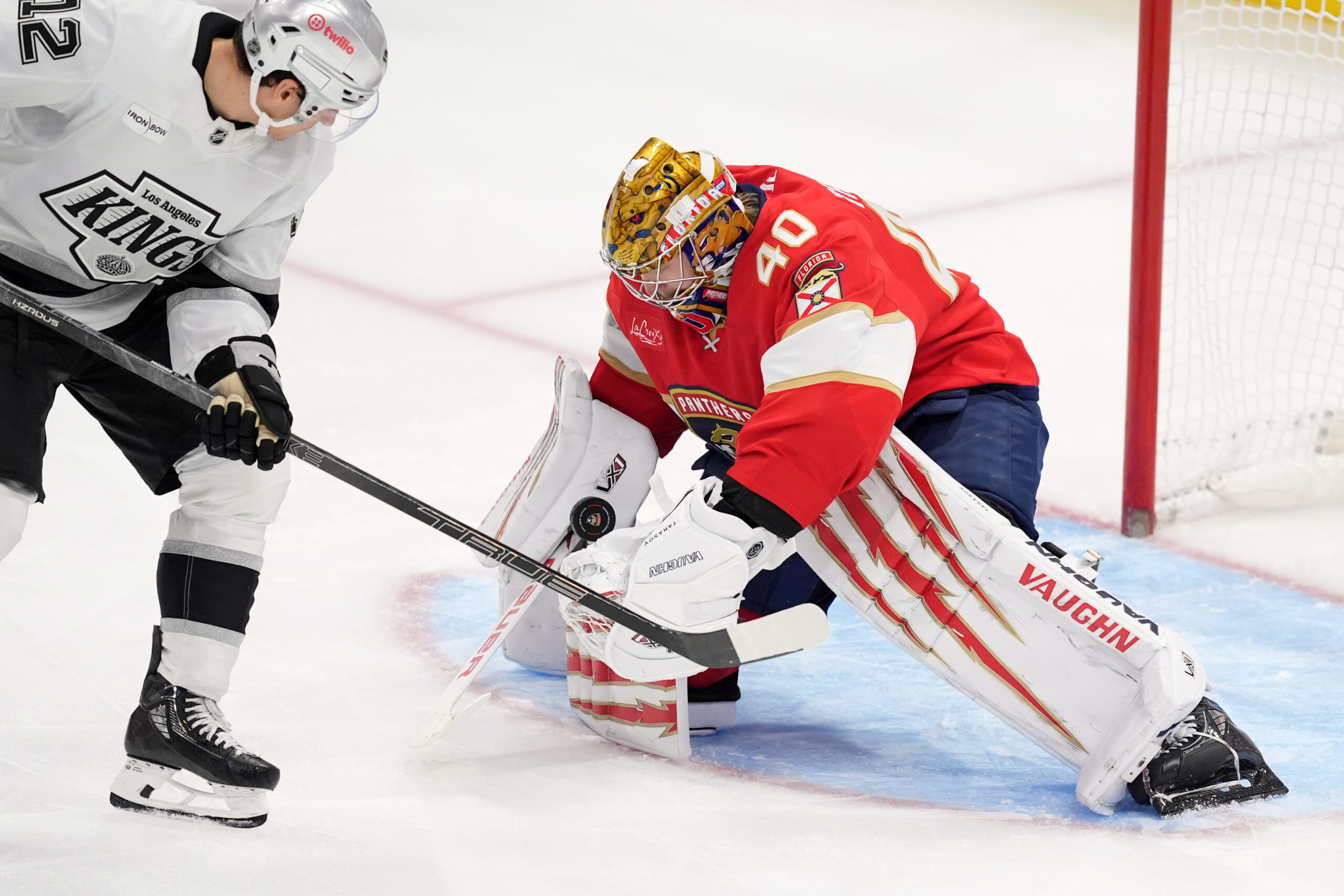 Florida Panthers goaltender Daniil Tarasov, right, stops a shot while...