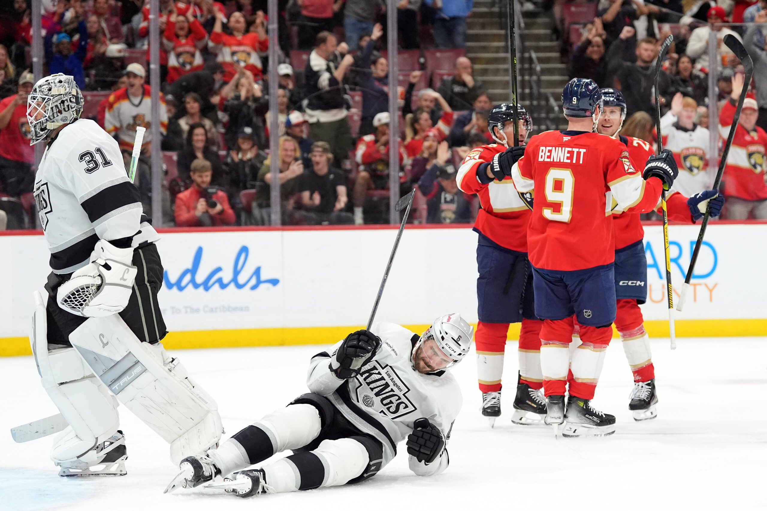 Florida Panthers center Carter Verhaeghe, right, celebrates with teammates after...