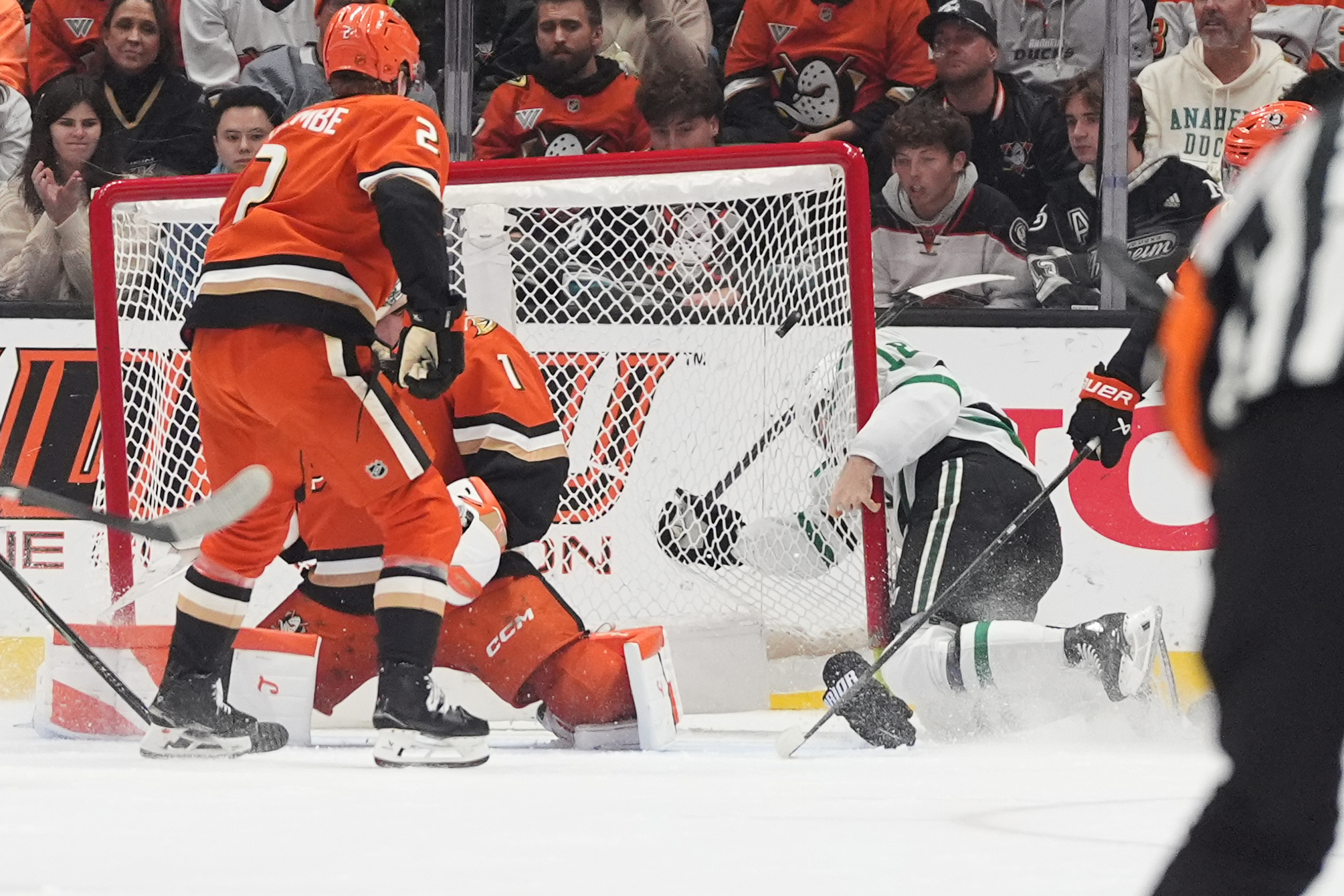 Dallas Stars center Sam Steel, center right, slams into the...