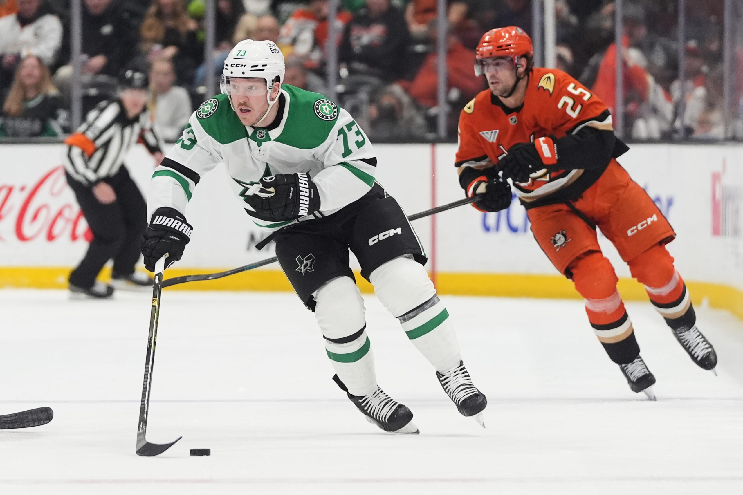 Dallas Stars left wing Adam Erne, left, controls the puck...