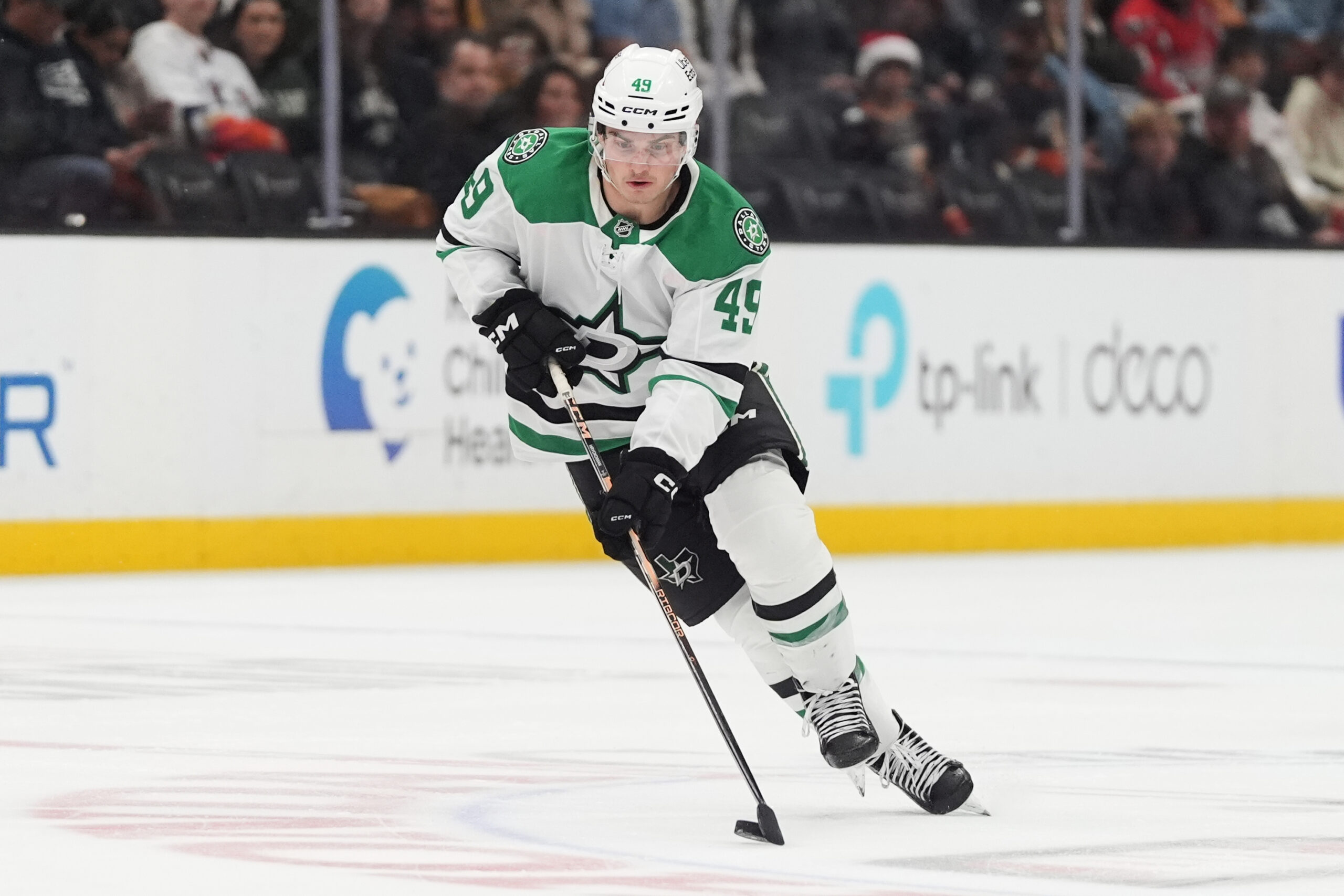 Dallas Stars center Justin Hryckowian controls the puck during the...
