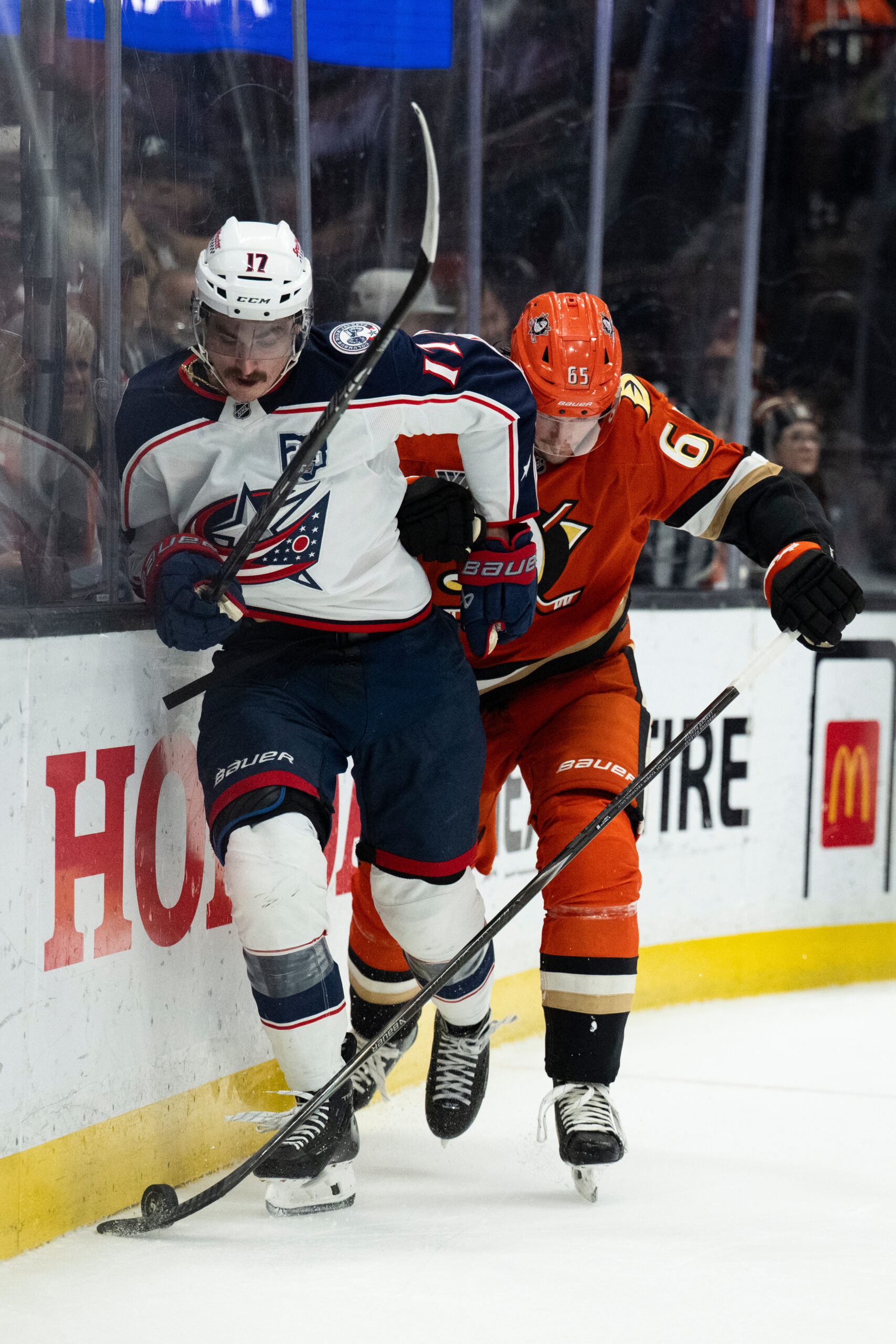 Columbus Blue Jackets left wing Mason Marchment, left, vies for...